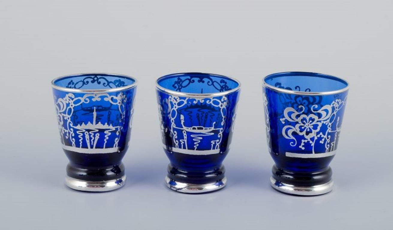 Venice, Italy. Liqueur set in blue glass: decanter and five cups. Mid-20th C. 2