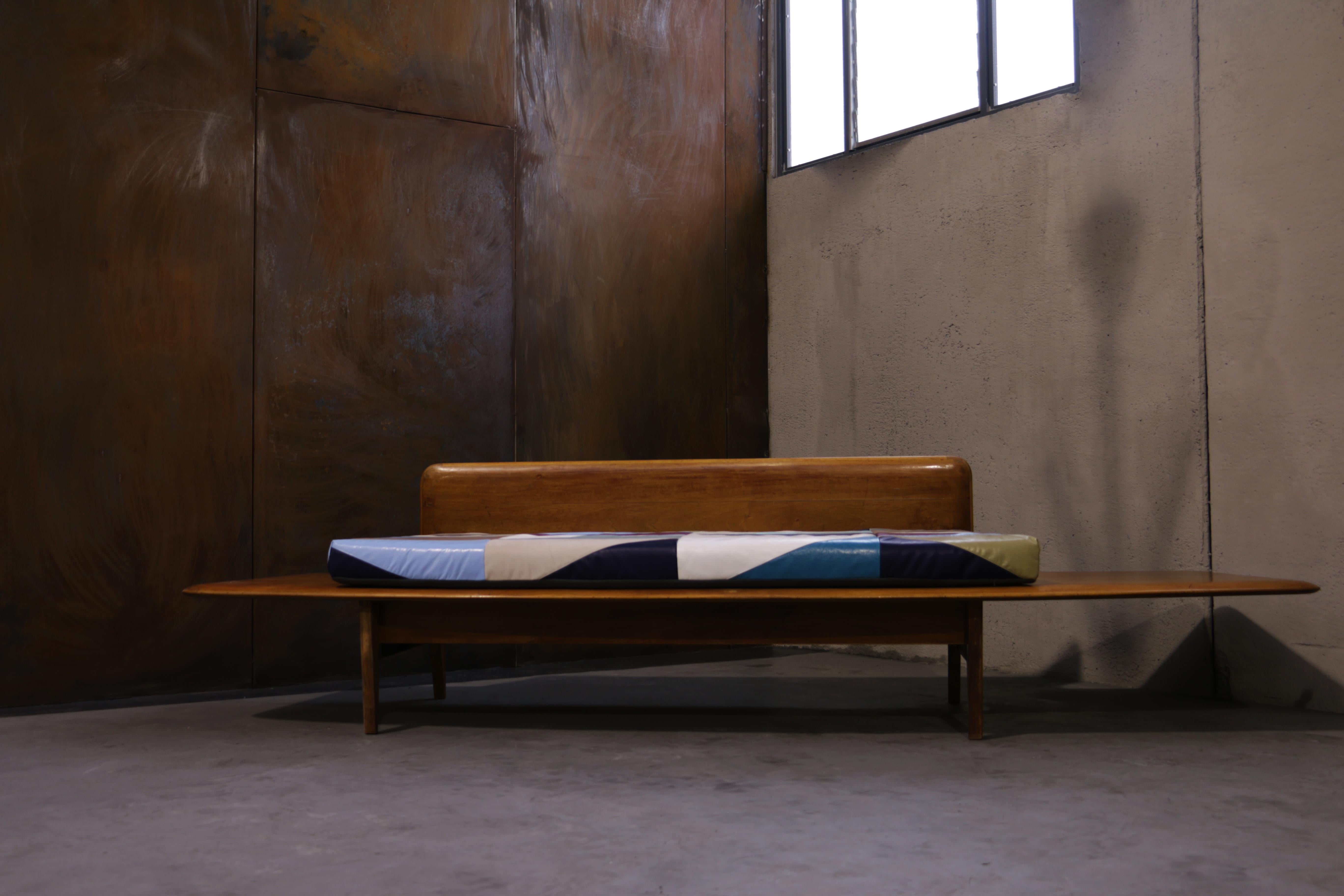 Recycled wood or recycled leather.

Daybed sofa made with an Italian headboard 1950 wood attributed to Gio Ponti, with mattress in vintage leather inspired to the Venetian Burano houses colors.