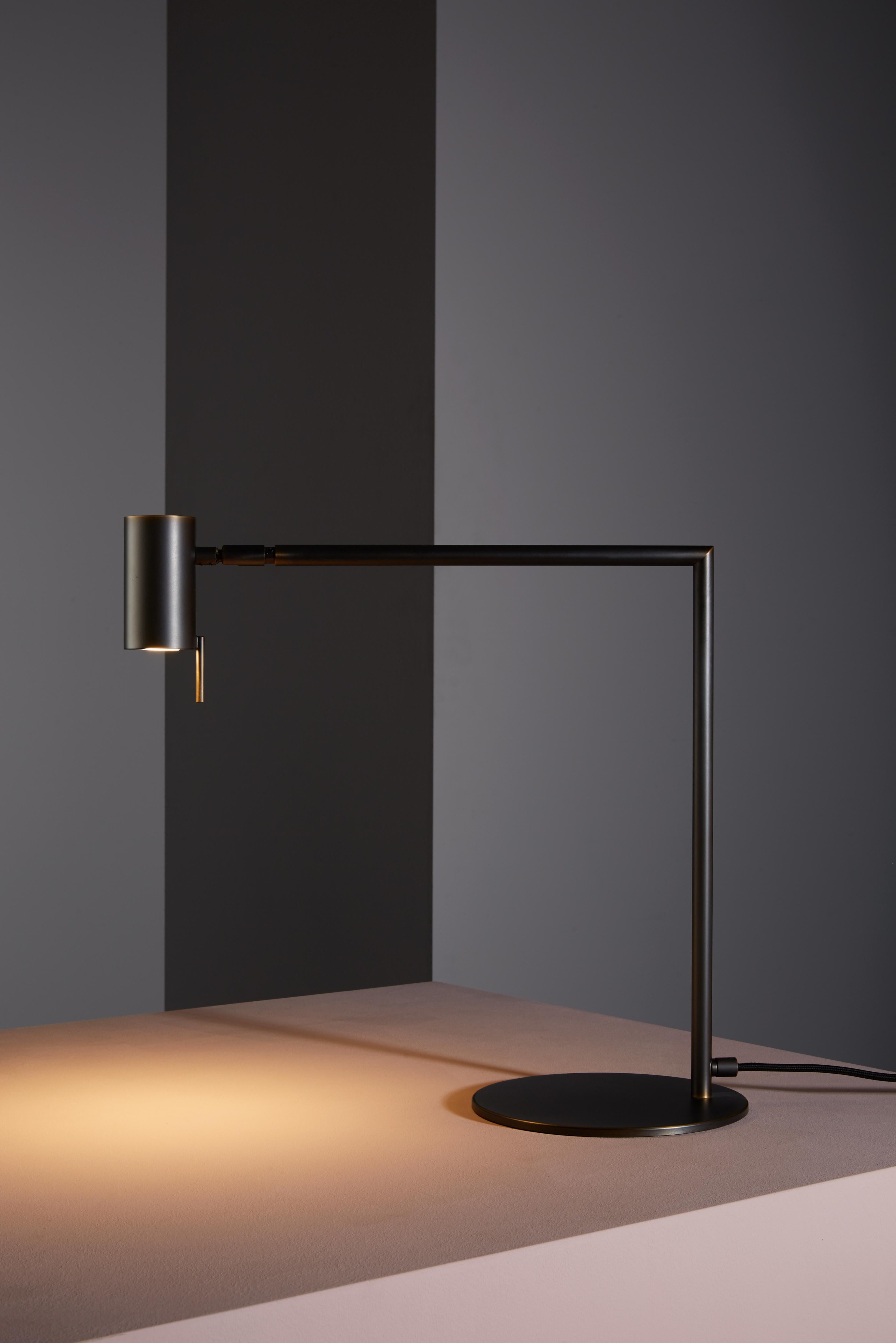 Table lamp with directional light. Dark burnished brass structure and adjustable joint.
 
Location: Interior
Light source: 1×6W GU10 PAR 16 LED 560lm 2700°K CRI 80
Voltage: 110 - 120 V / 220 - 240 V
Frequency: 50 - 60 Hz
Dimmable: Yes (bulbs