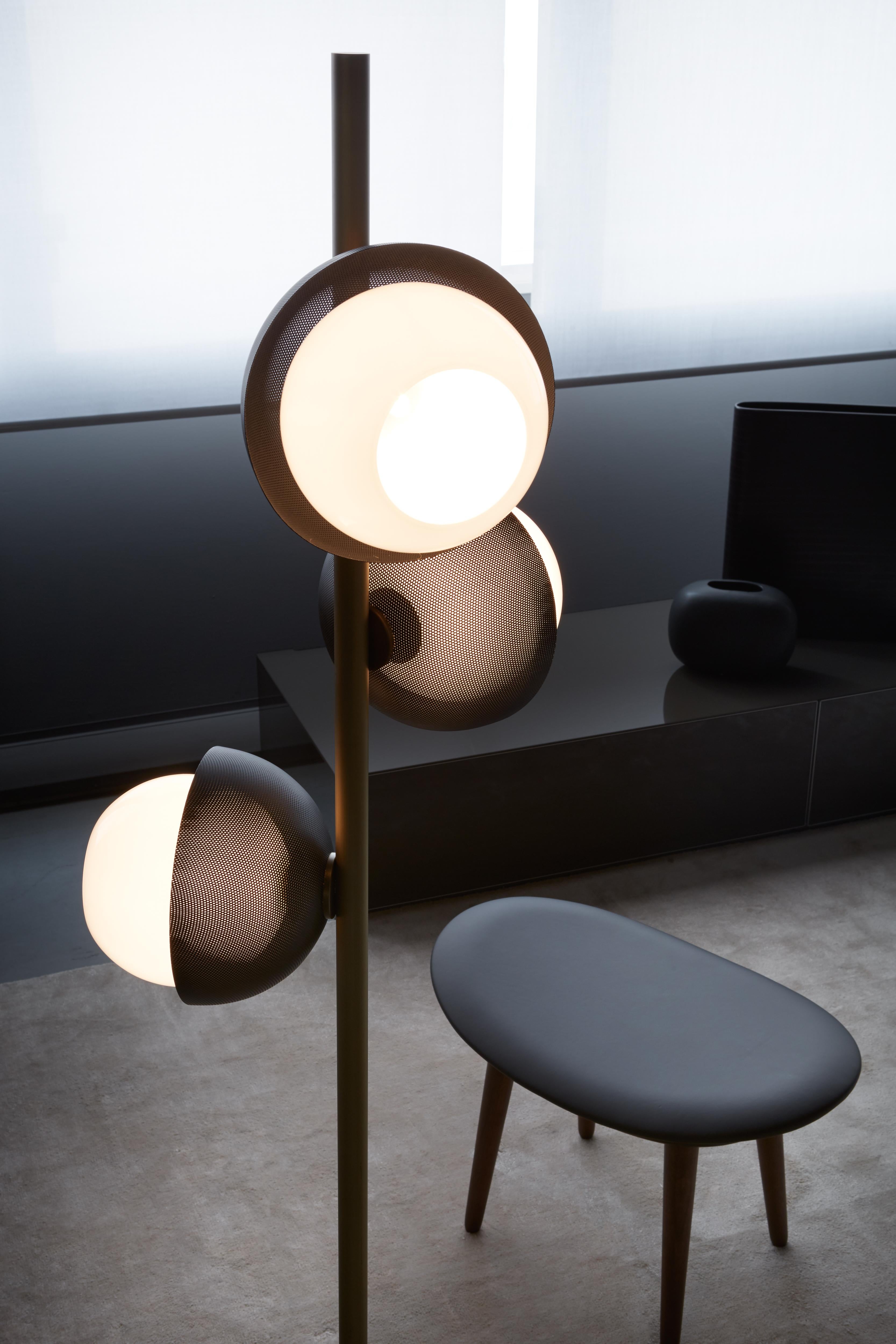 Floor lamp with diffused light. Light burnished brass structure with matte gold or matte black perforated metal lampshade. White Murano blown glass diffuser.
Specifications:
Function: Floor
Location: Interior
Light emission: Diffused