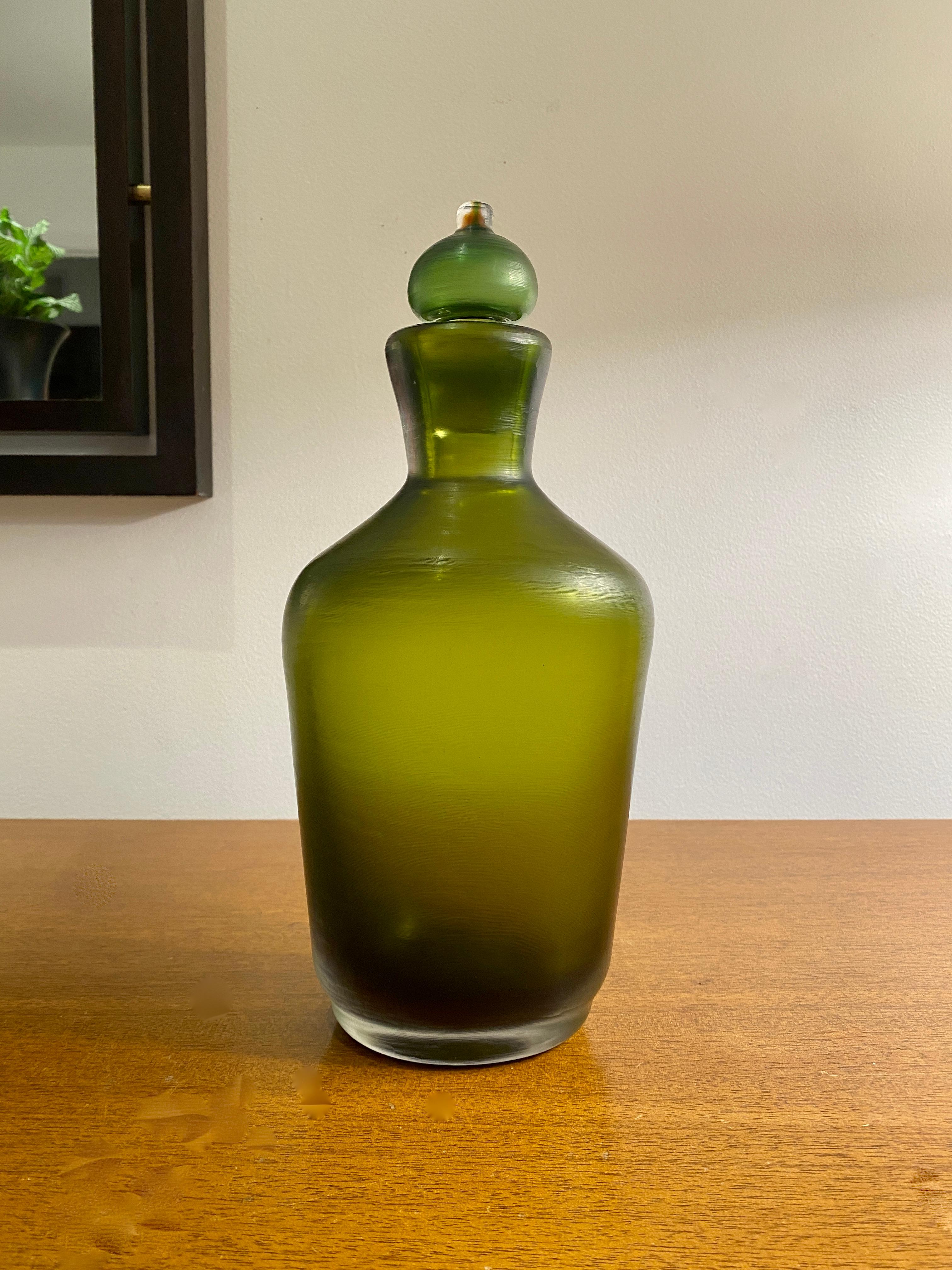 A beautiful bottle with stopper by Paolo Venini for Venini from the 1950's. The bottle is 