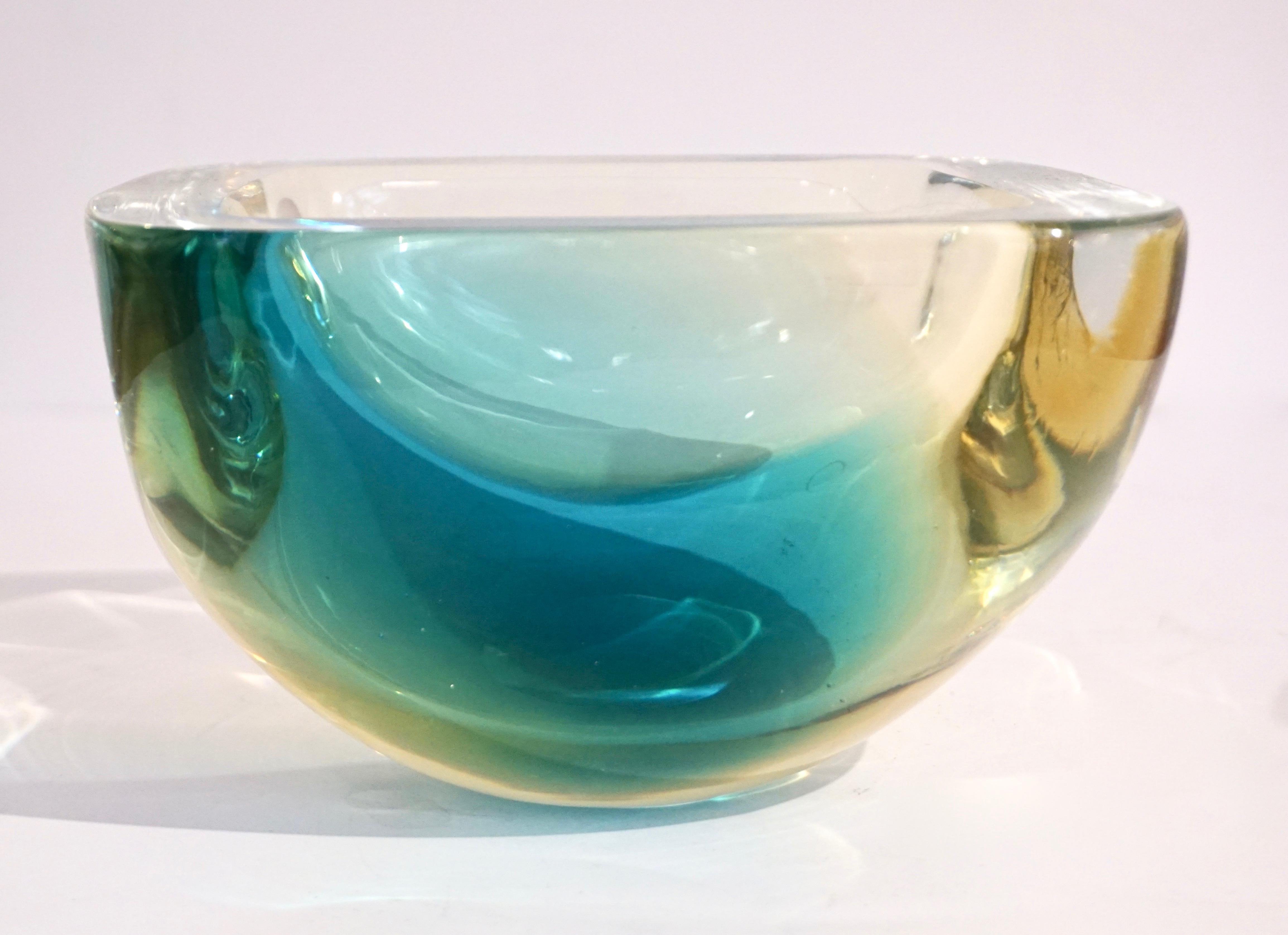 Vintage organic modern 1970s blown Murano glass square bowl or catchall dish in yellow amber and aqua green, signed by Venini, elegantly decorated in patch colors that catch the light and enhance the shape with flat cut polished top. Also, available