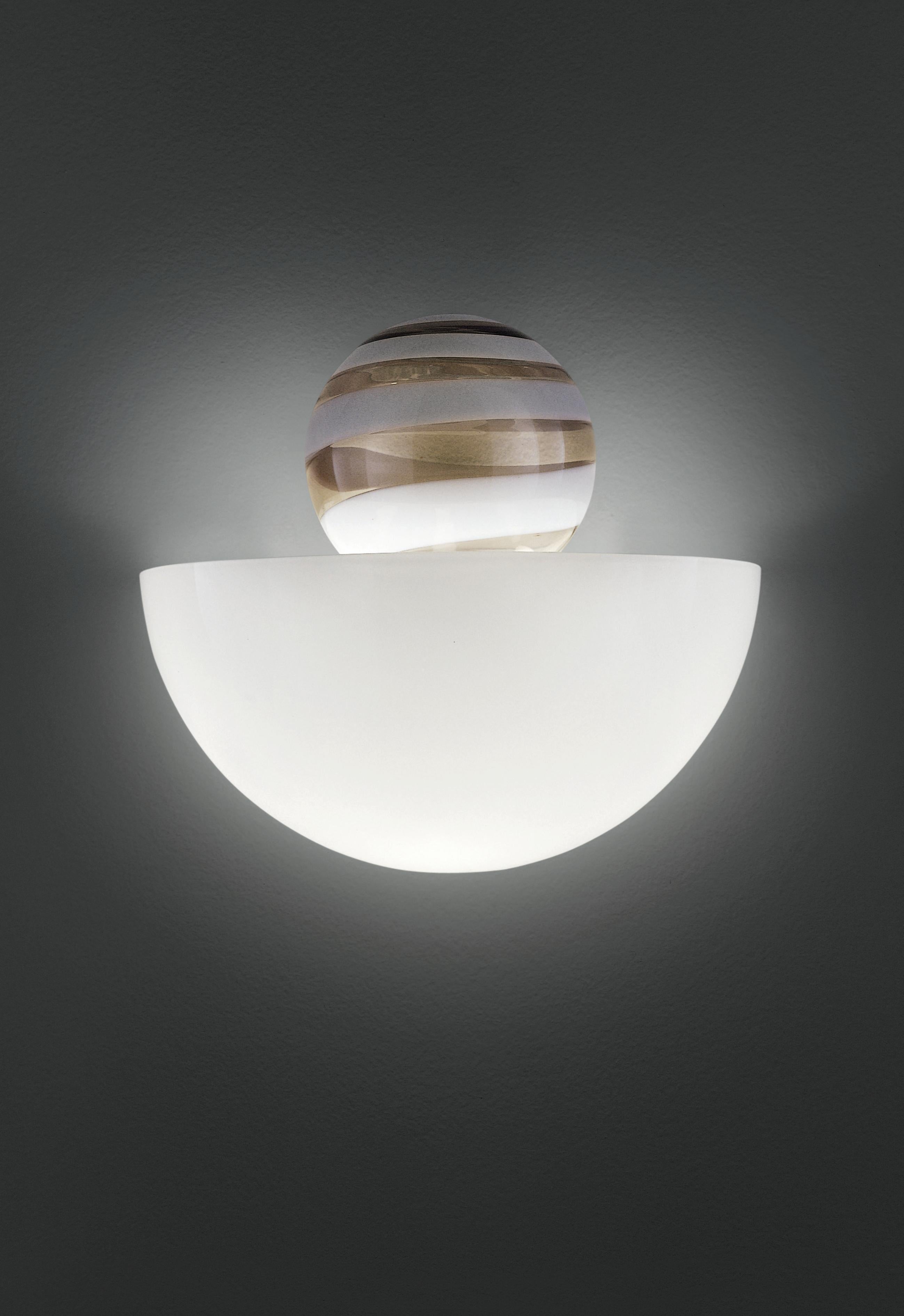 Abaco wall sconce in handmade blown glass. Simple and decorative lighting solution for any room or environment. Also available in other colors or as a flush light.

Dimensions: 21 cm D x 40 cm W x 35 cm H.