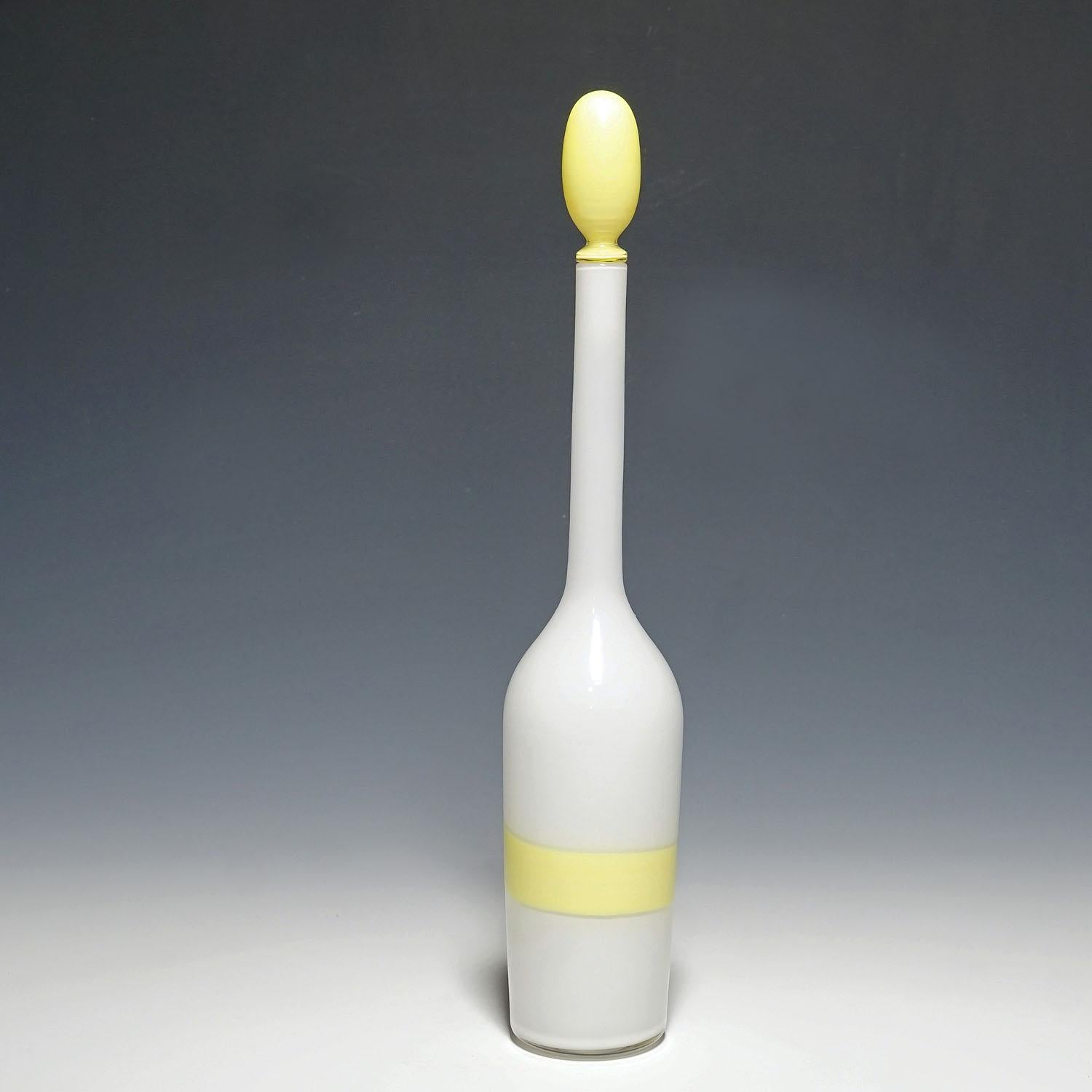 Venini art glass bottle with Fasce decoration in yellow, Murano 1950s

A large art glass bottle in white opaque glass with yellow stopper and a yellow 