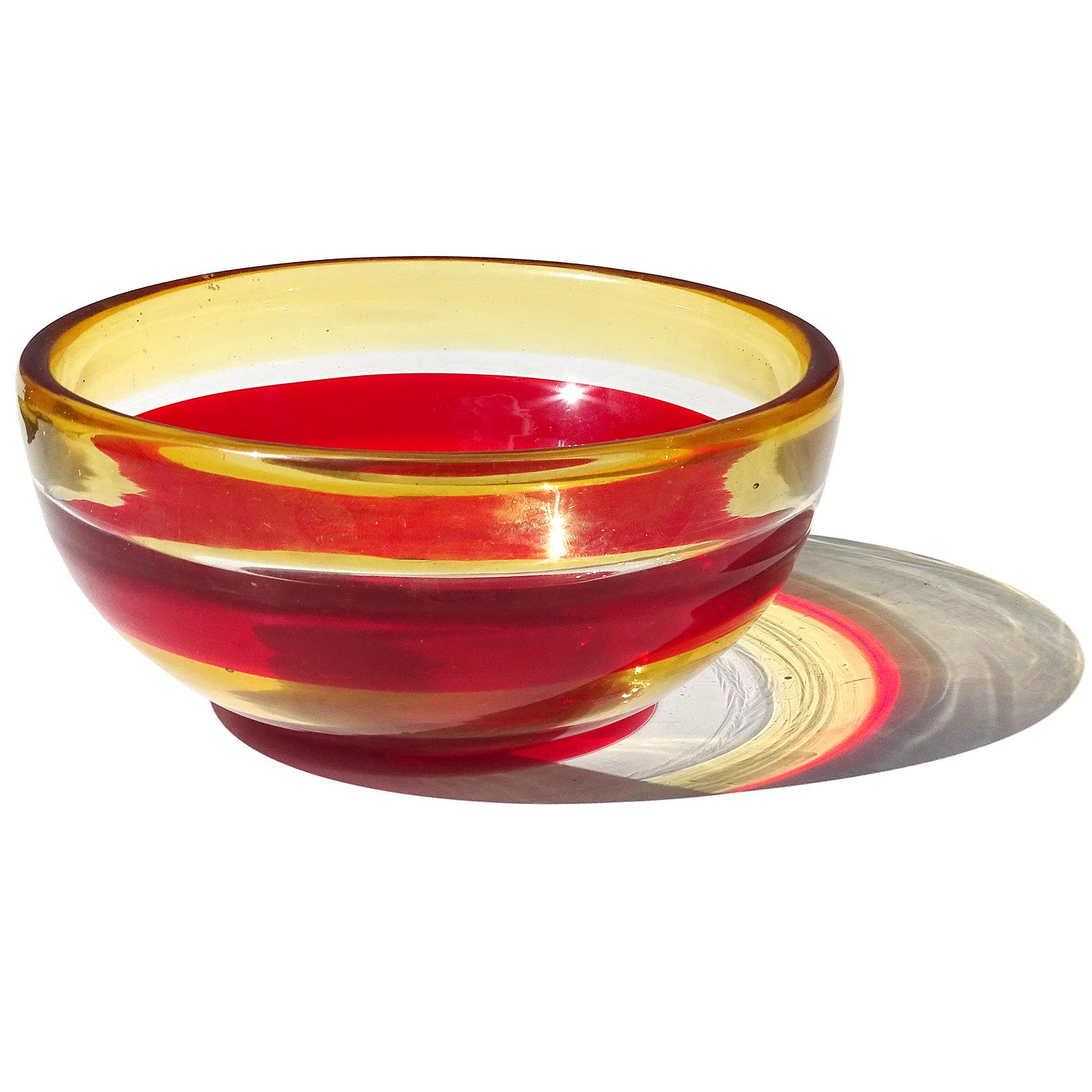Beautiful, vintage Murano hand blown red and yellow-orange stripes Italian art glass decorative bowl. Documented to designer Fulvio Bianconi, circa 1950s, in the 