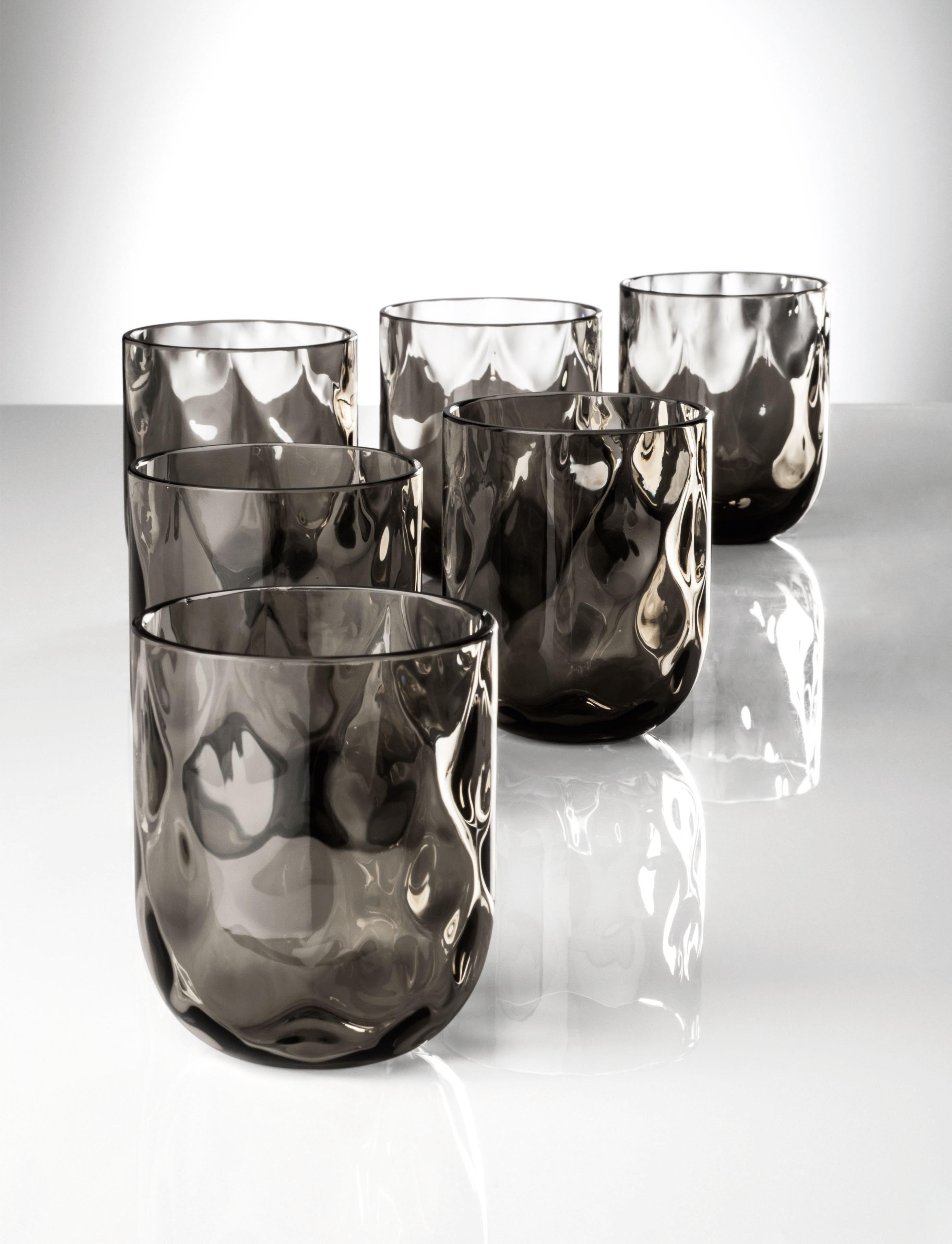 Bicchieri Carnevale glass set, designed and manufactured by Venini, consists of 6 Murano glass glasses.

Dimensions: Ø 8 cm, H 9 cm.