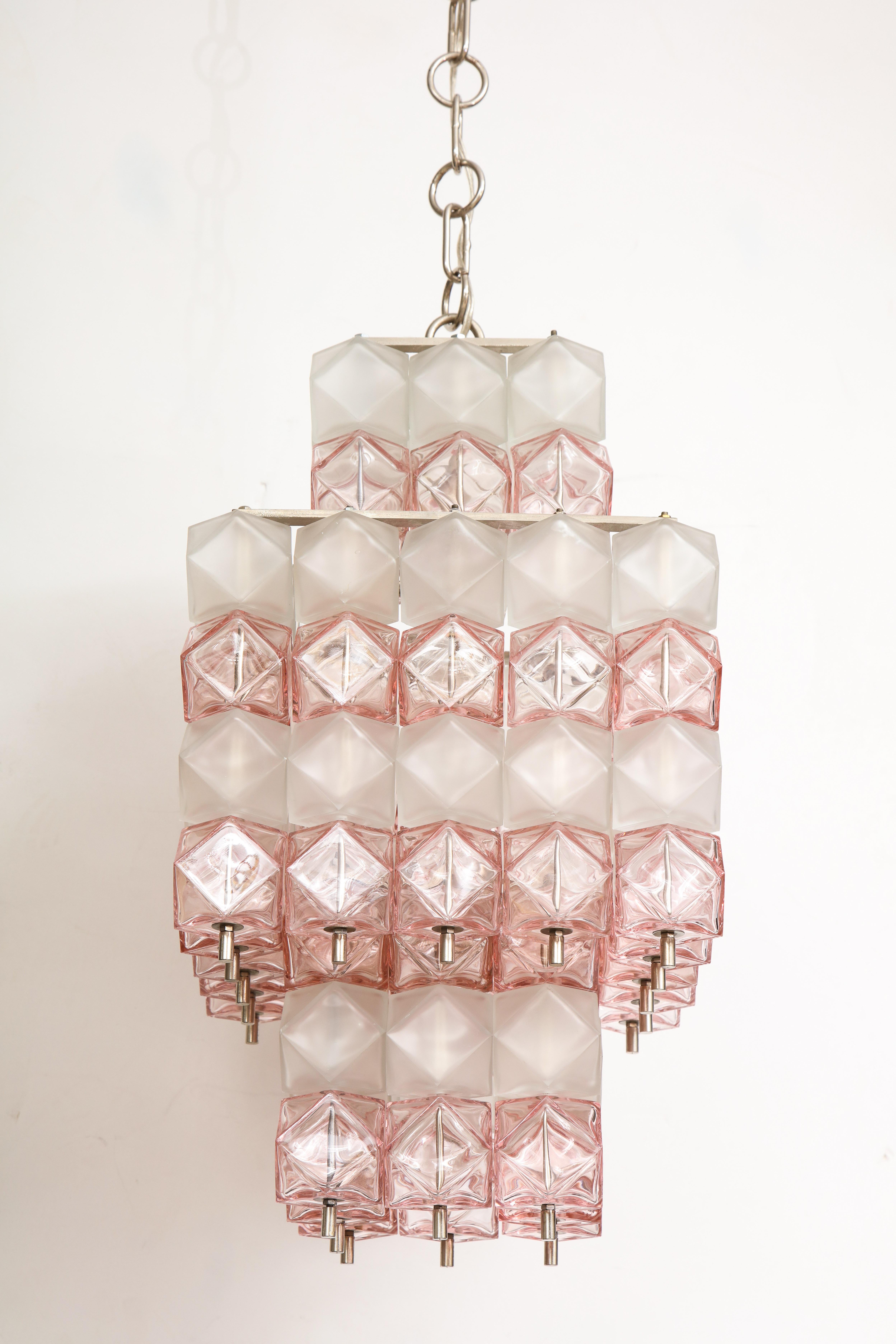 Mid-Century Murano glass chandelier composed of translucent blush pink and frosted white glass polyhedral elements suspended on matte steel frame. Rewired for use in the USA. Uses candelabra type bulbs.