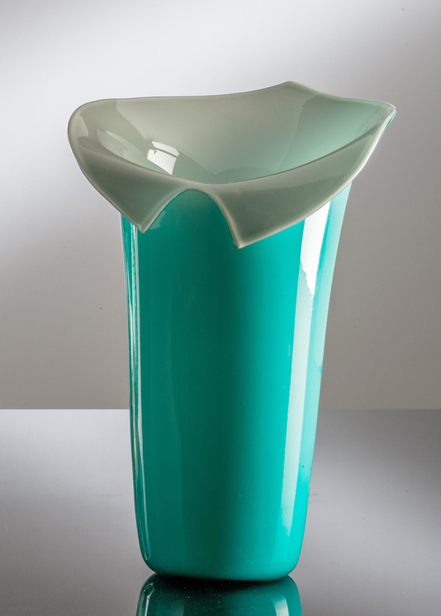 Calla glass vase, designed and manufactured by Venini, is a limited edition of 99 art pieces in mint green / grey color. Indoor use only.

Dimensions: Ø 22 cm, H 30 cm.