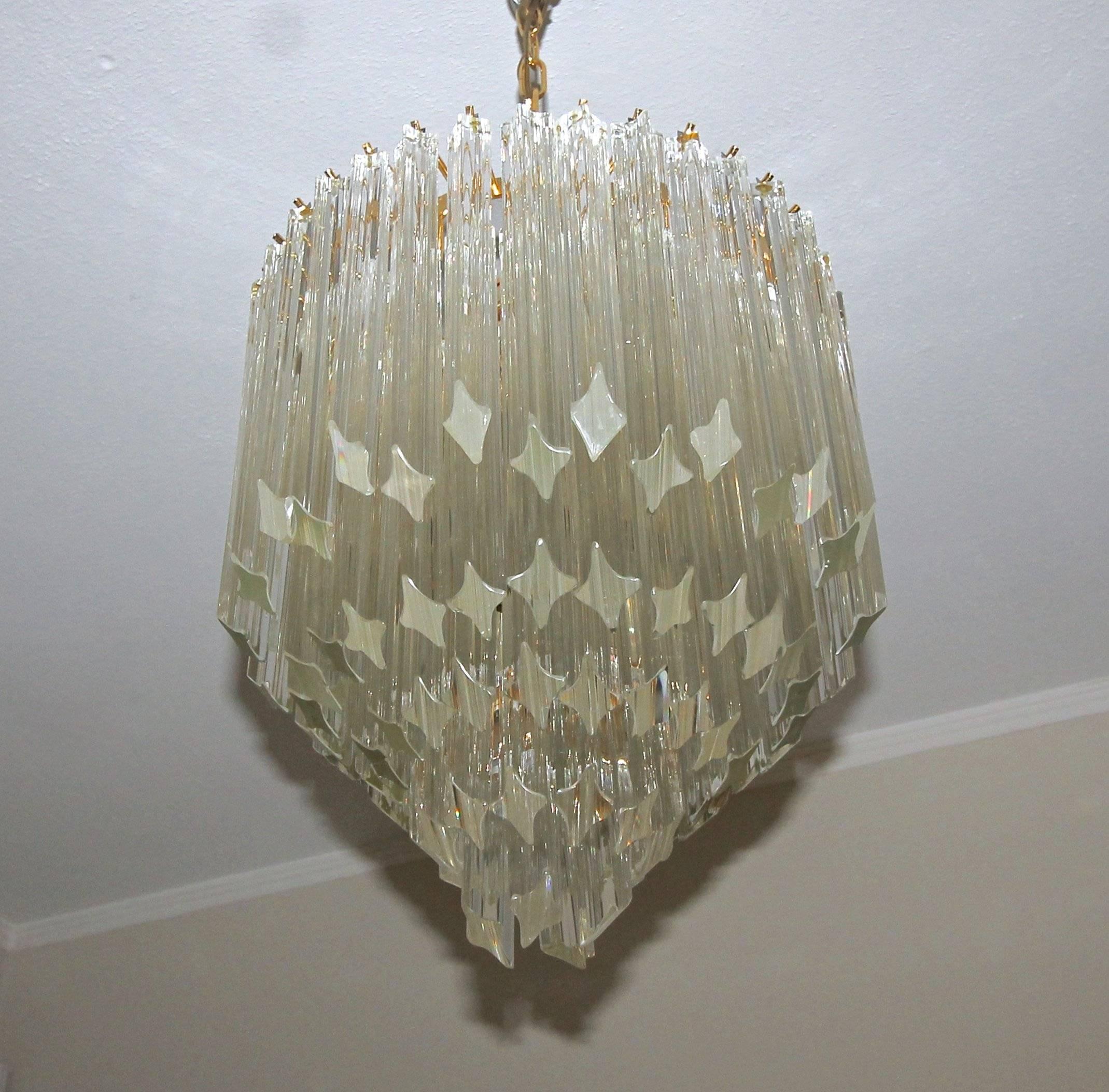 Round multi-tier triedri glass chandelier with clear glass crystal prisms and brass-plated steel frame. Great vintage Italian Murano design in the manner of Venini and manufactured by Camer glass. Newly wired for US, fixture uses six candelabra base