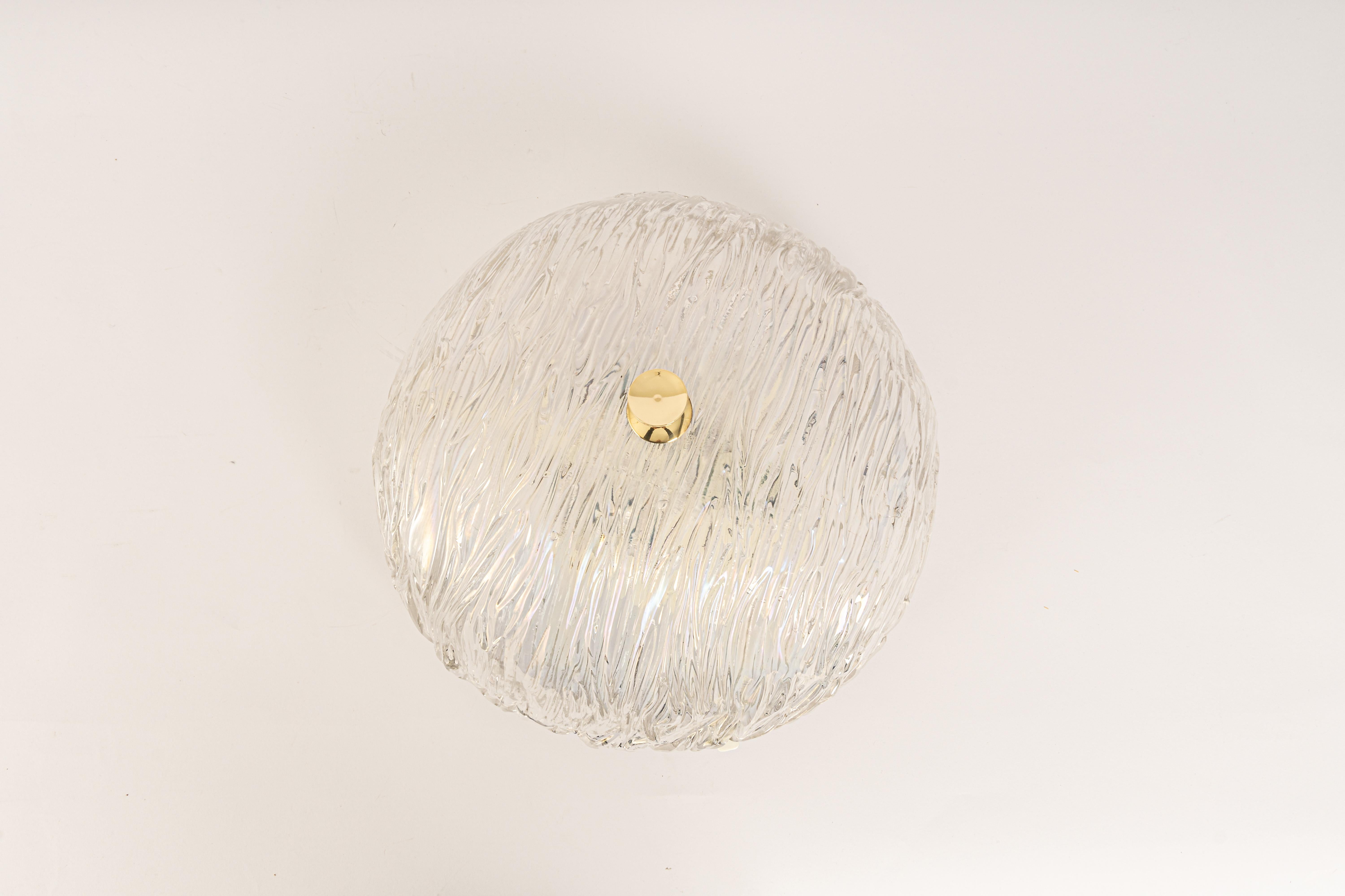 Venini ceiling lights attributed to Carlo Scarpa for Venini, 1960s.
Wonderful light effect.
The heavily textured and slightly iridescent glass dome is held in place by a brass knob

High quality and in very good condition. Cleaned, well-wired