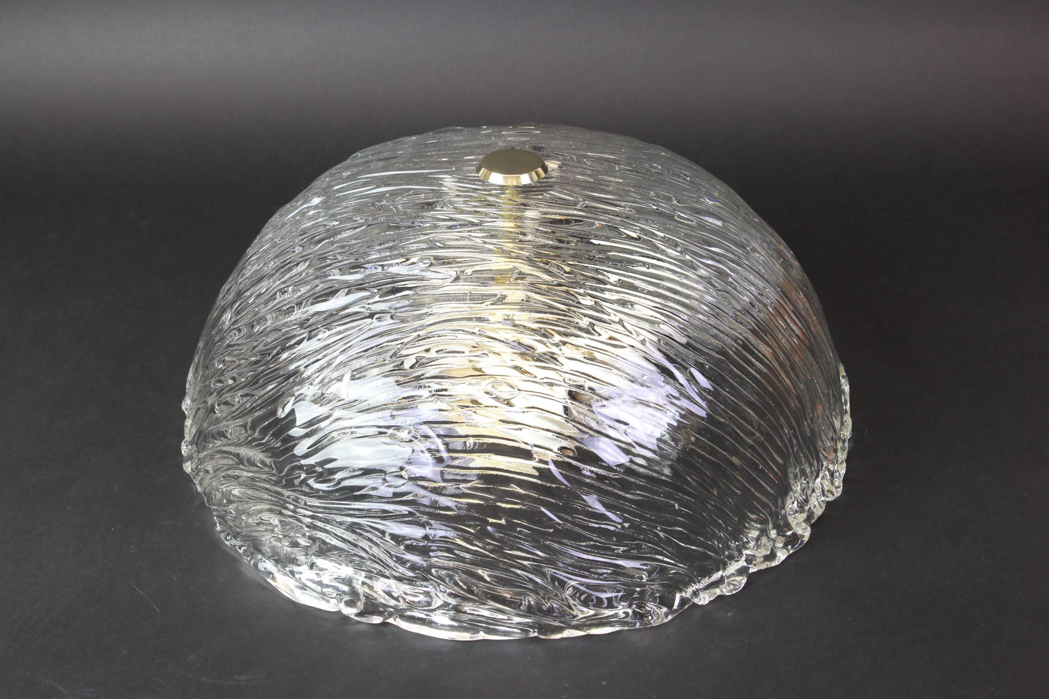 Venini ceiling lights attributed to Carlo Scarpa for Venini, 1950s.
Wonderful light effect.
The heavily textured and slightly iridescent glass dome is held in place by brass knob

High quality and in very good condition. Cleaned, well-wired and