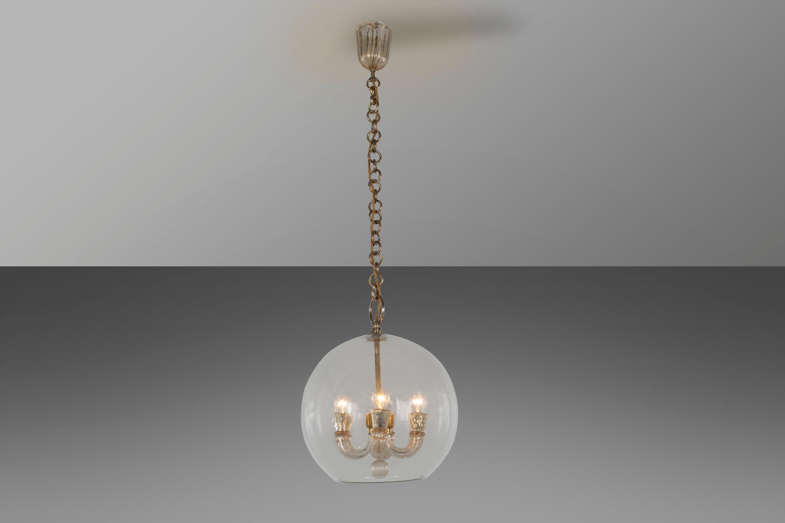 The Murano glass chandelier is divided into two distinct sections, the finely executed glass sphere with delicate glass surrounding the internal structure. The glass inside has shades of gold set in Murano glass while the support chain is made of