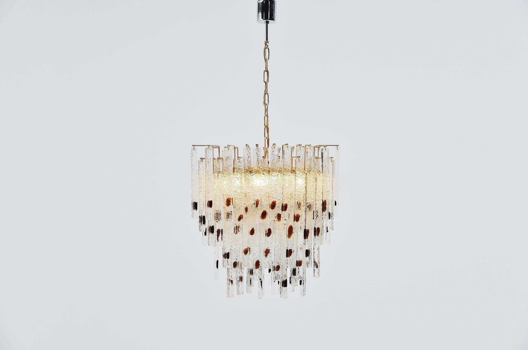 Very nice large and impressive chandelier designed by Paolo Venini and manufactured by Venini Murano, Italy, 1960. This chandelier has 95 waterfall looking glass pegs which give a great diffused light effect when lit, transparent glass with brown