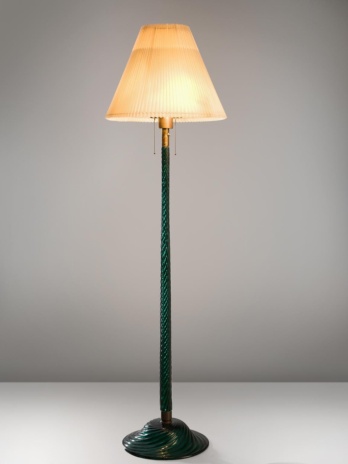 Venini floor lamp, glass, Italy, design 1934, production later.

This Classic floor lamp is executed in a wonderful clear color. The lamp has a ribbed, 'costelature' stem and base. Thanks to this artful skill this floor lamp is much more than a