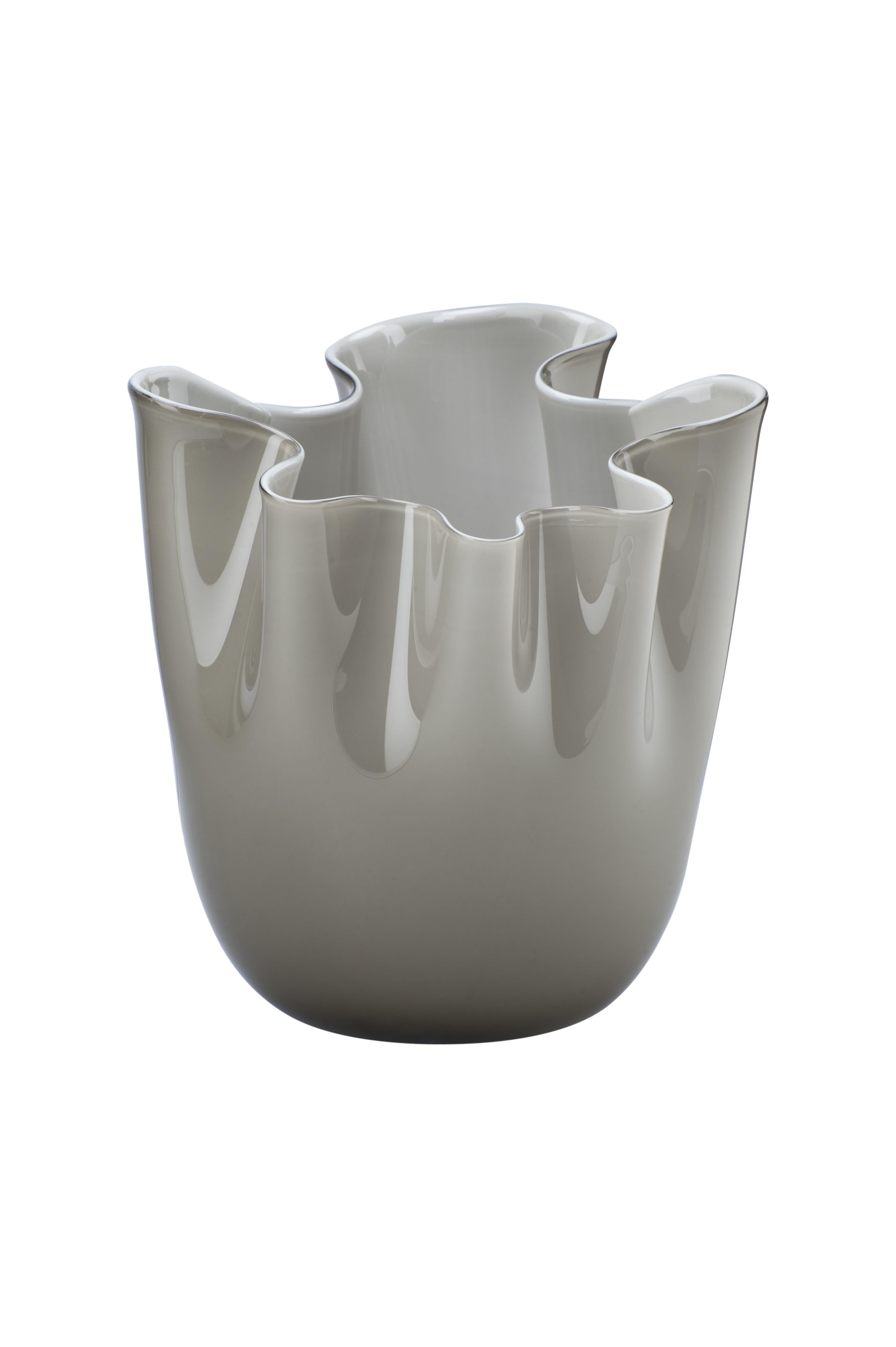 Fazzoletto glass vase, designed by Fulvio Bianconi and Paolo Venini and manufactured by Venini, is available in three different sizes. Original designed in 1948. Indoor use only.

Dimensions: Ø 23 cm, H 31 cm.