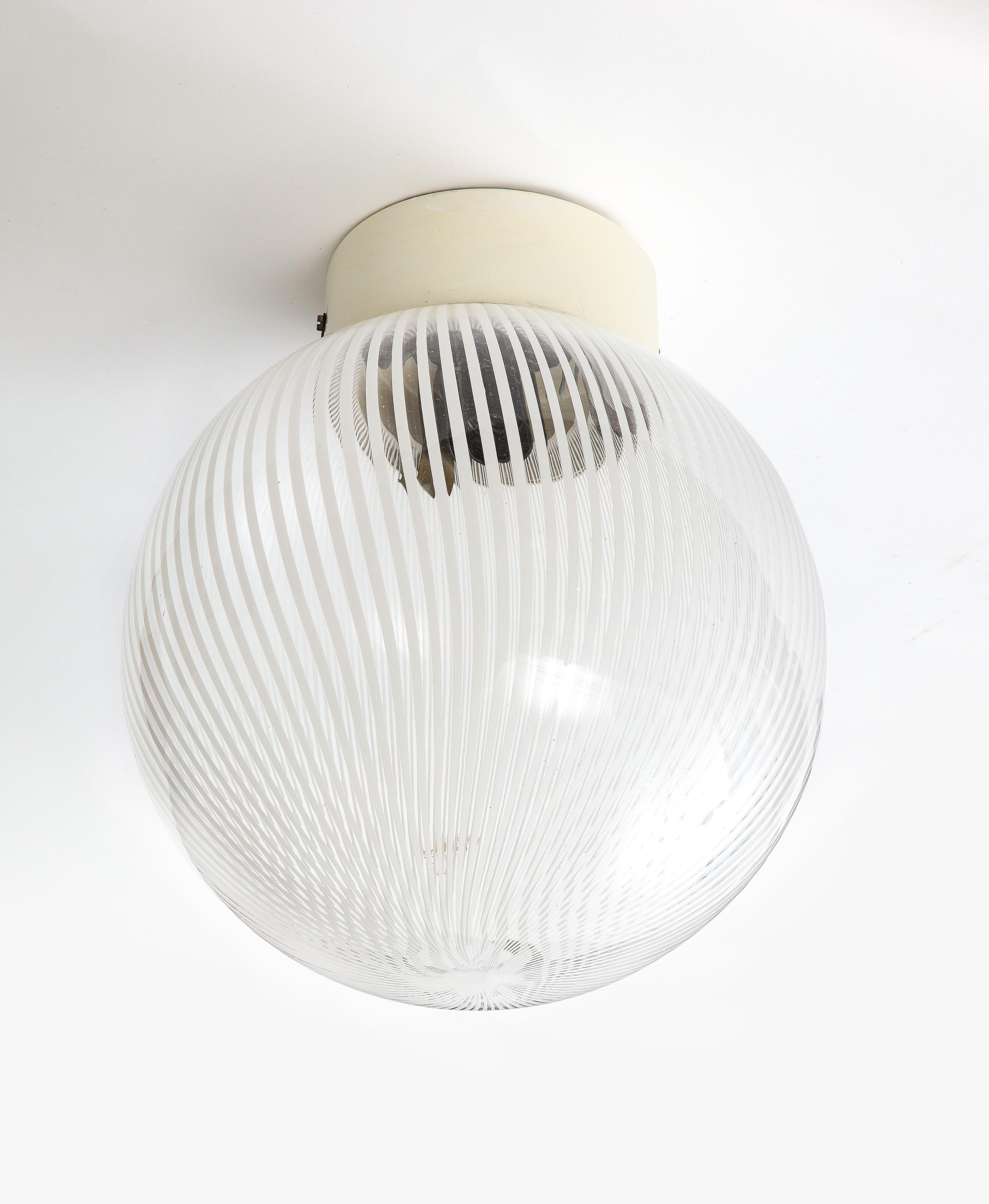 Simple, stylish flush mount with a striped pattern etched into the glass.