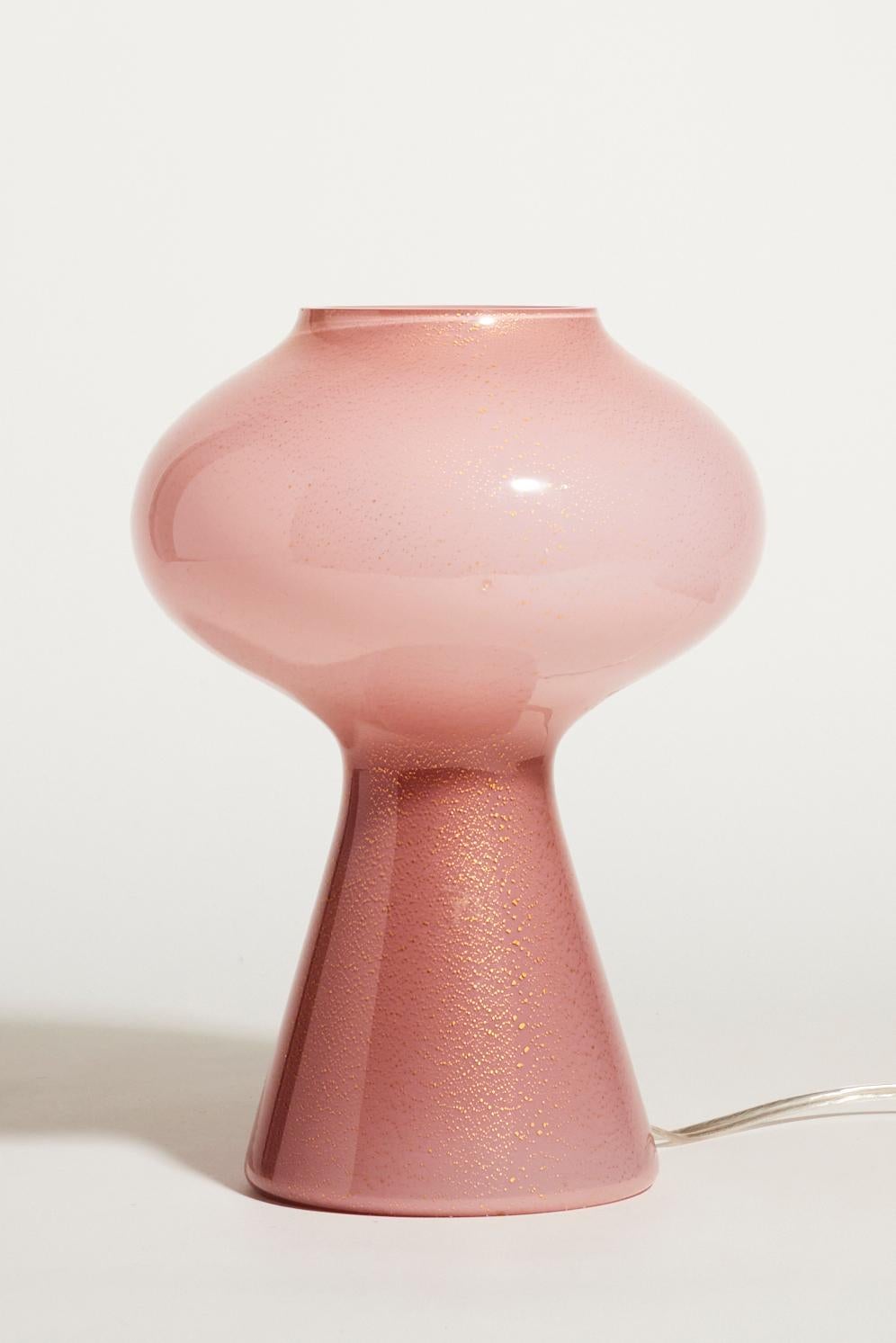 Beautiful mid century Murano lamp in dusty rose glass flecked with gold
 It was in production for several decades, these lights were produced in different sizes and this is the smaller version.