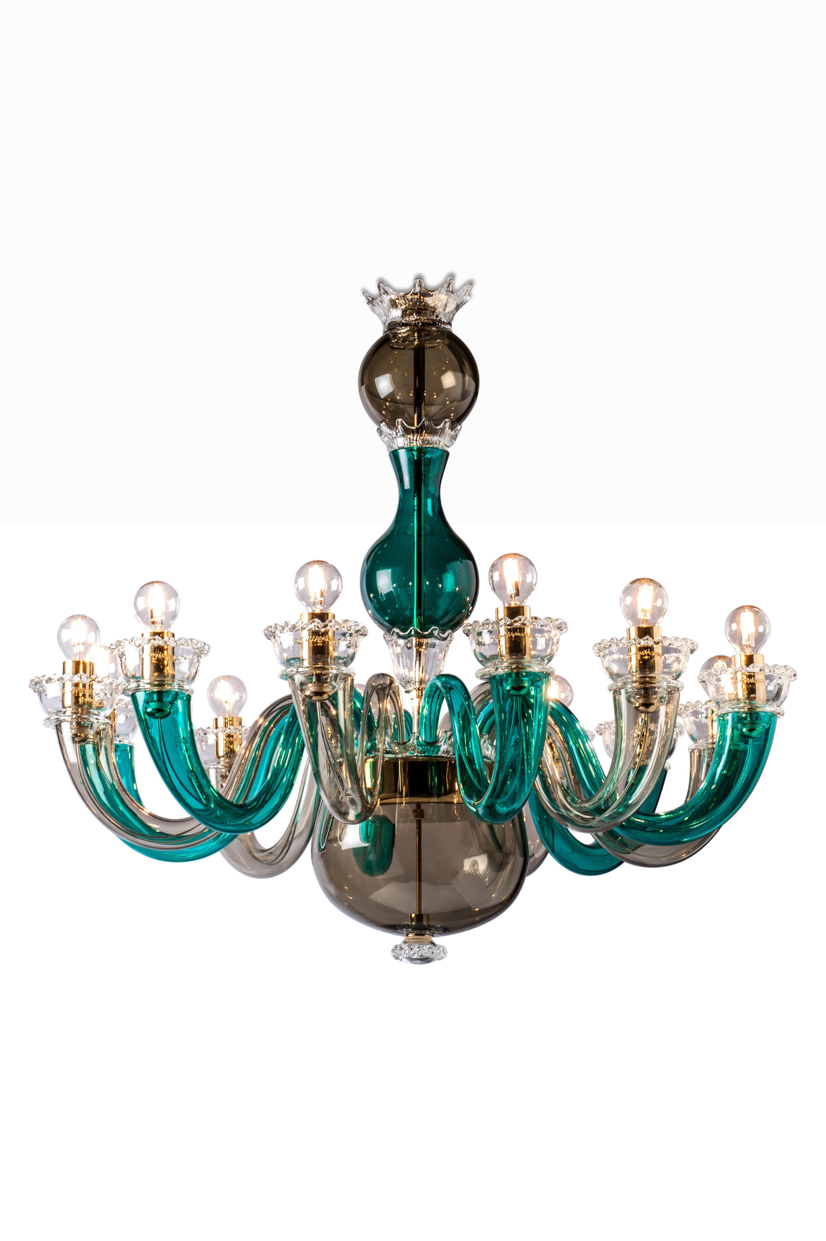 Glass chandelier with gold plated metal finishes and chain. A colorful chandelier with a touch of elegance that adds color to any living room or entrance space. Also available in various sizes and colors. 

Light source: 12 x max 60 W E 14.
