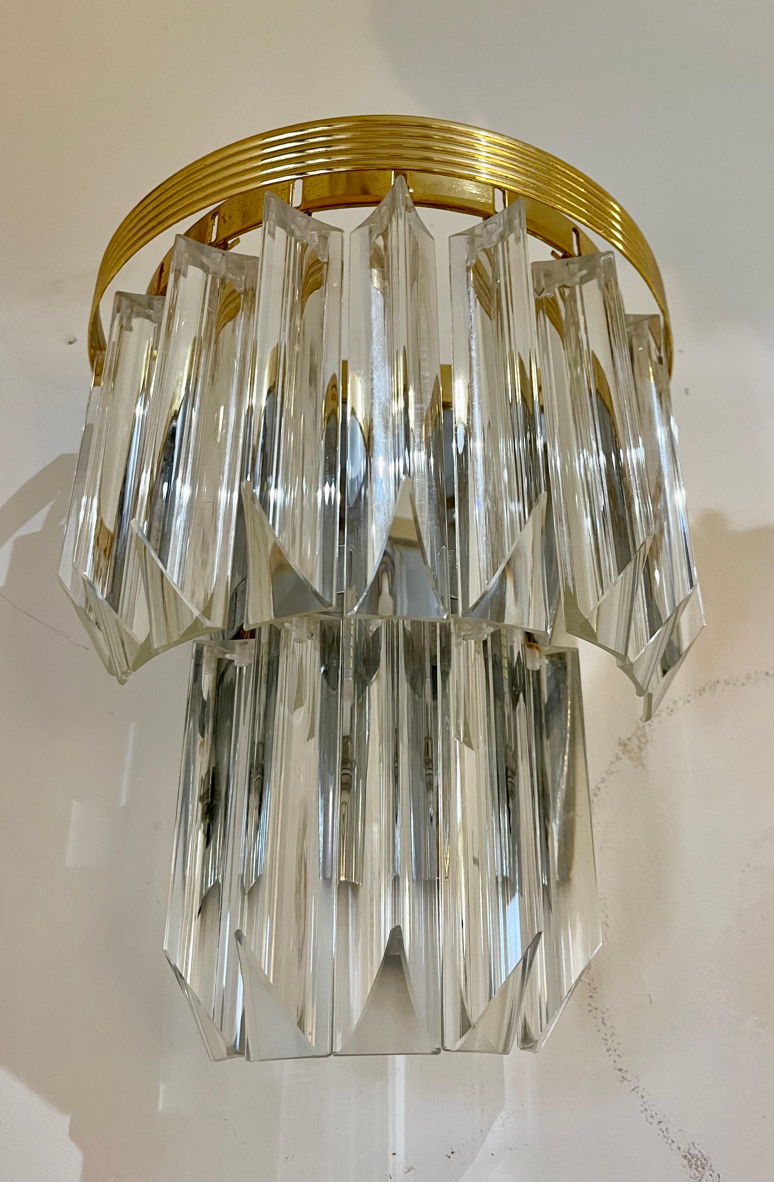 Venini design wall lighting murano glass with in iridium glass. The design and the quality of the glass make this piece the best of the design.
This wall lighting pair are in good condition.

Venini is an Italian company that is known for its