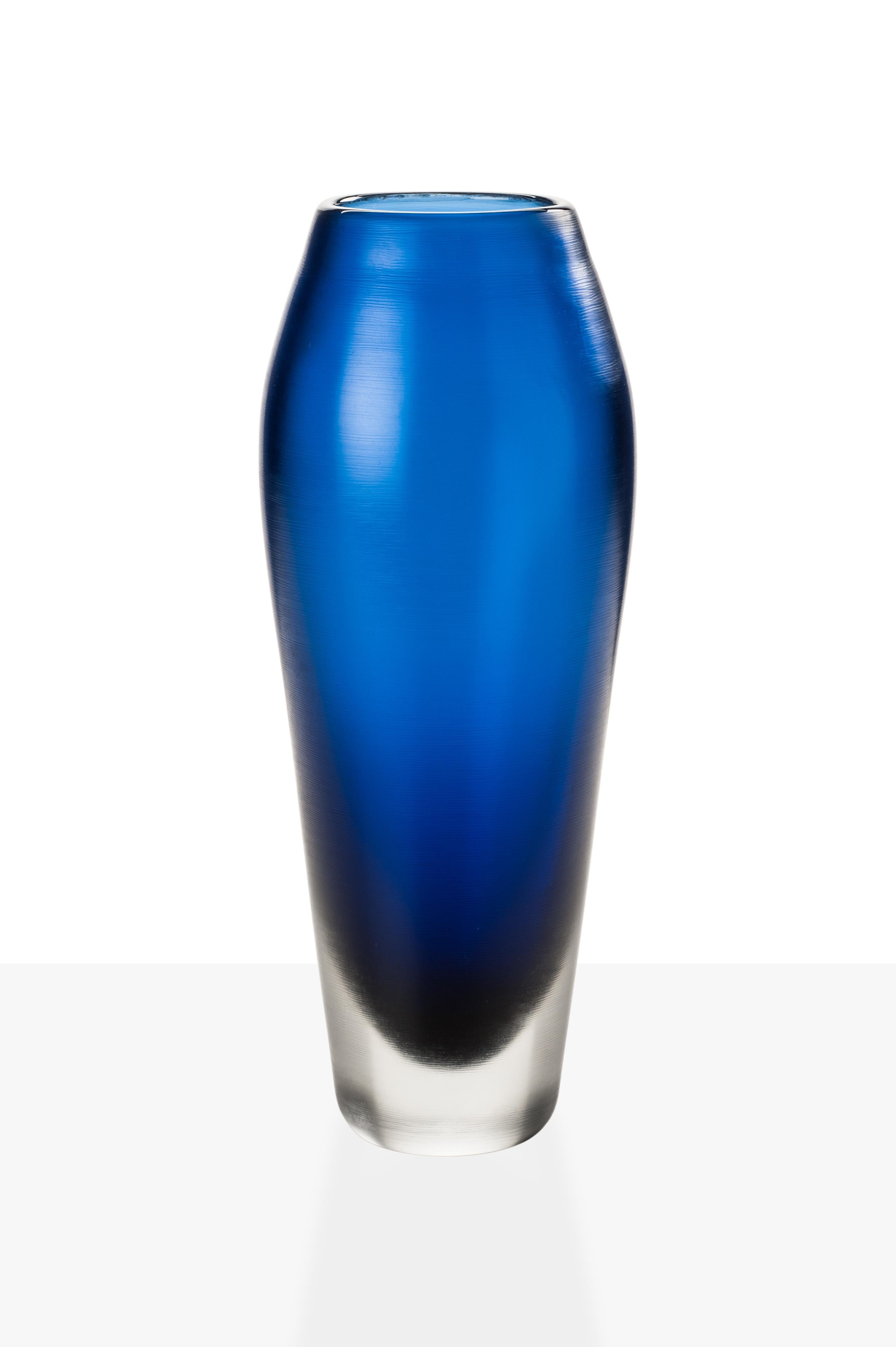 Incisi glass vase collection, designed by Paolo Venini and manufactured by Venini, feature an engraved surface. Originally designed in 1956. Numbered edition per year, marine blue versions are available in a limited edition of 19 art pieces. Indoor