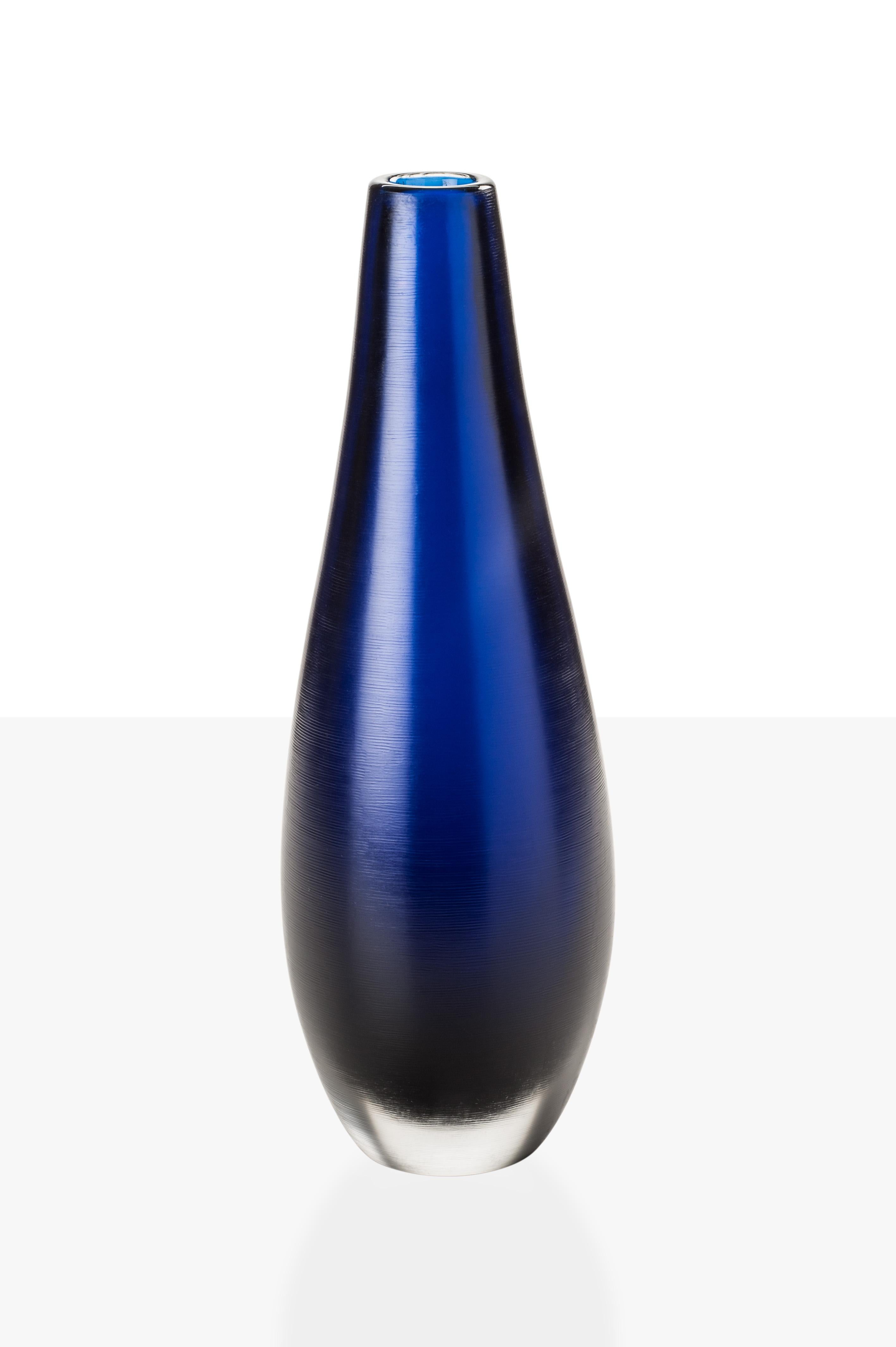 Incisi glass vase collection, designed by Paolo Venini and manufactured by Venini, feature an engraved surface. Originally designed in 1956. Numbered edition per year, marine blue versions are available in a limited edition of 19 art pieces. Indoor