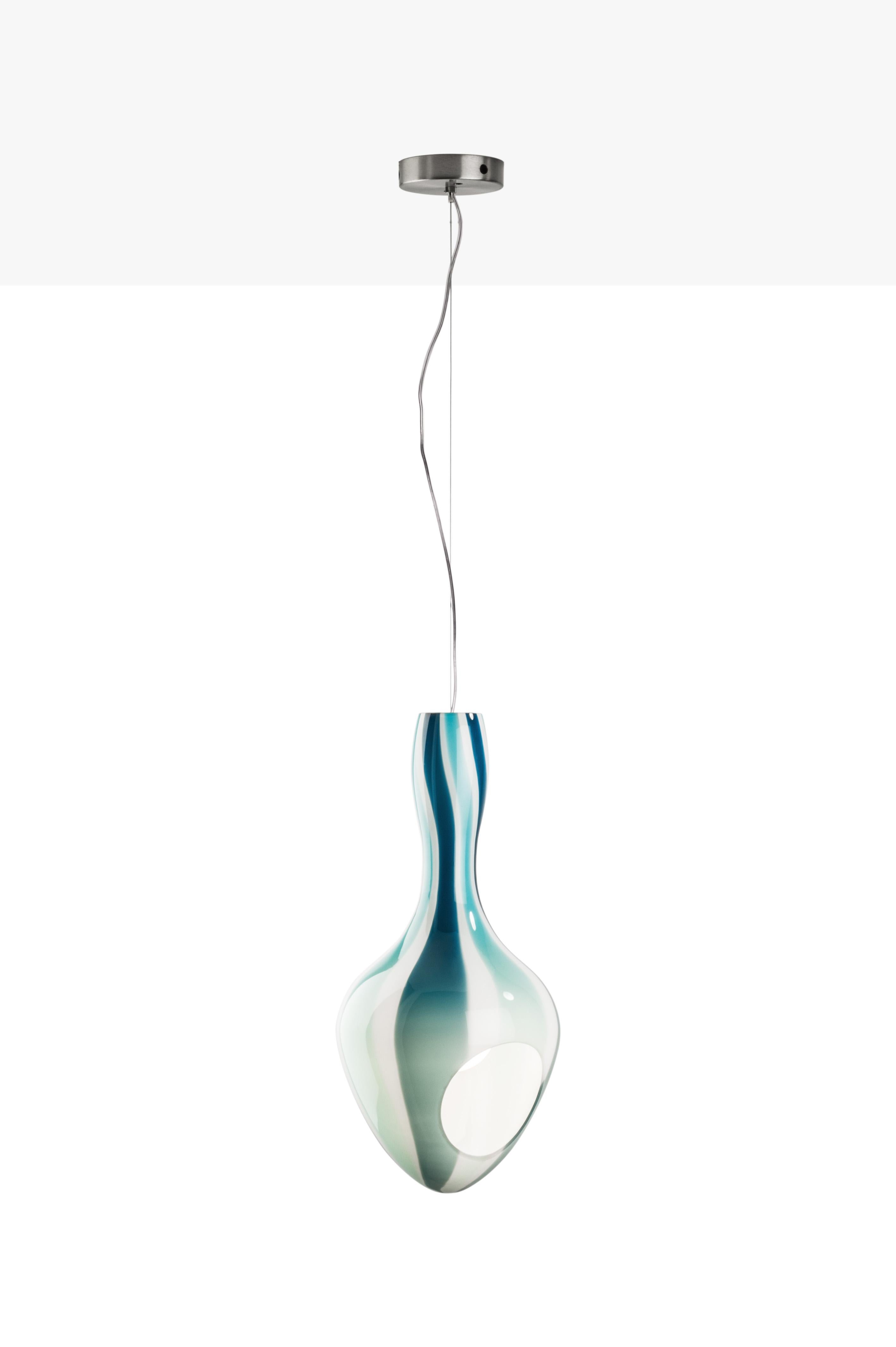 Venini Kokoon Swing lamp by Sotirios Papadopoulos.
Project: Nicole Visonà, Sotirios Papadopoulos

Color:
Milk-White/Bands: Violet/Gray
Milk-White/Bands: Mint Green/Horizon
Metal: Chromium-plated
Measurements: Ø 9.44