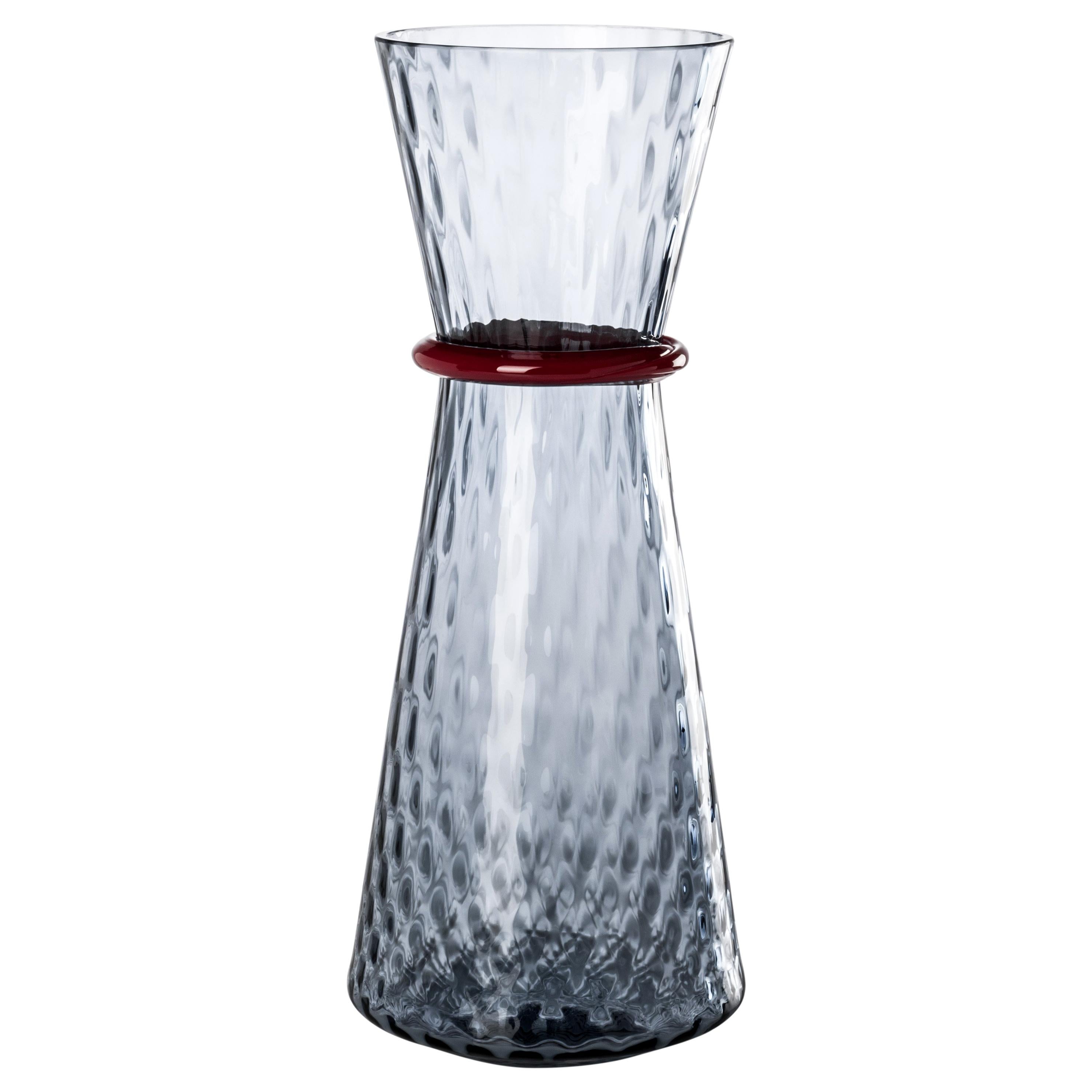 Tiara glass vases, designed by Francesco Lucchese and manufactured by Venini, is available in two different sizes. Indoor use only.

Dimensions: Ø 19 cm, H 46 cm.