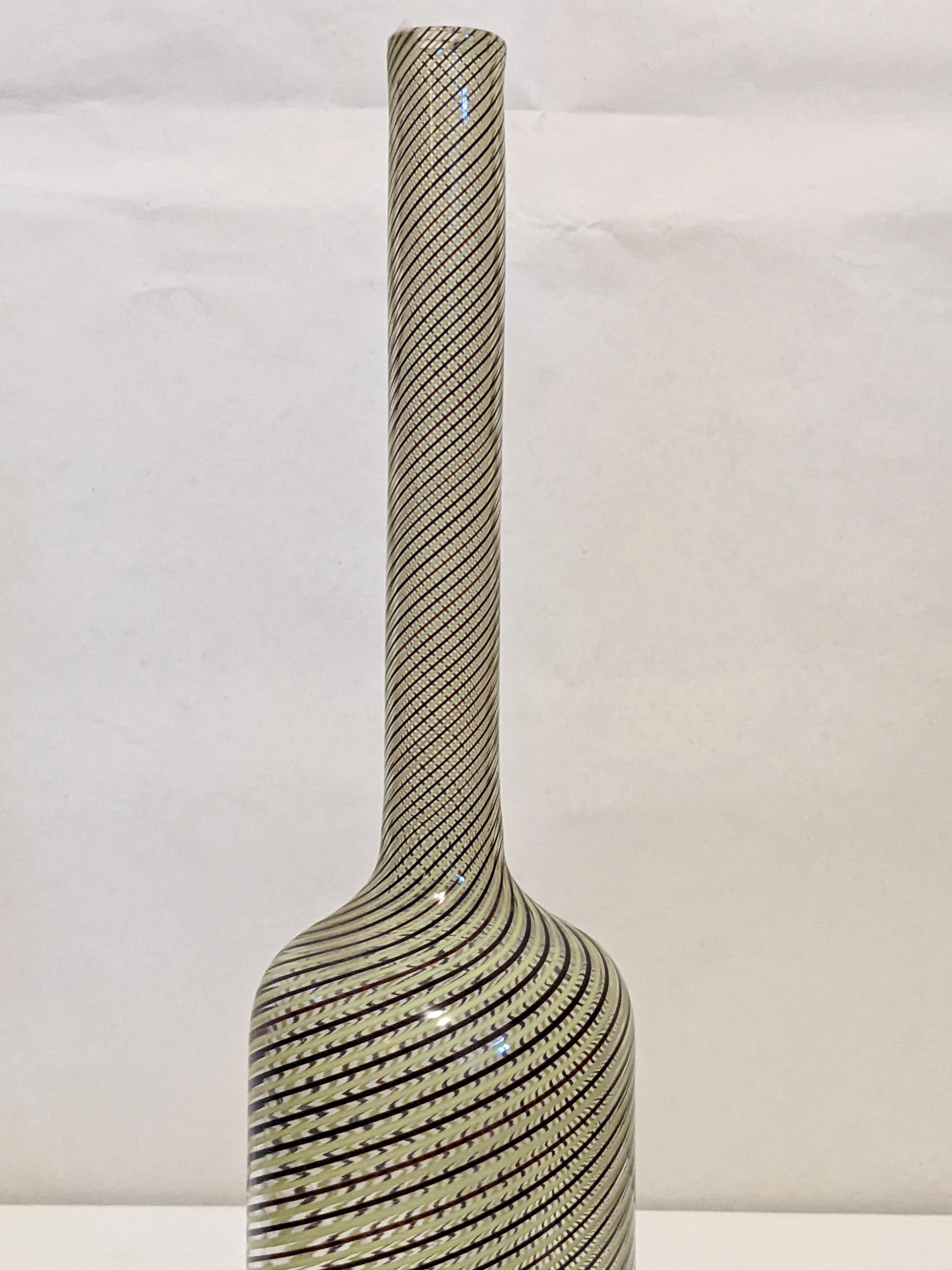 Lovely, period Venini Mezza filigrana bottle circa 1950's of spiraling threads in yellow and black on crystal with elongated neck, conical stopper, possibly by Paolo Venini or Gio Ponti for Venini. 14