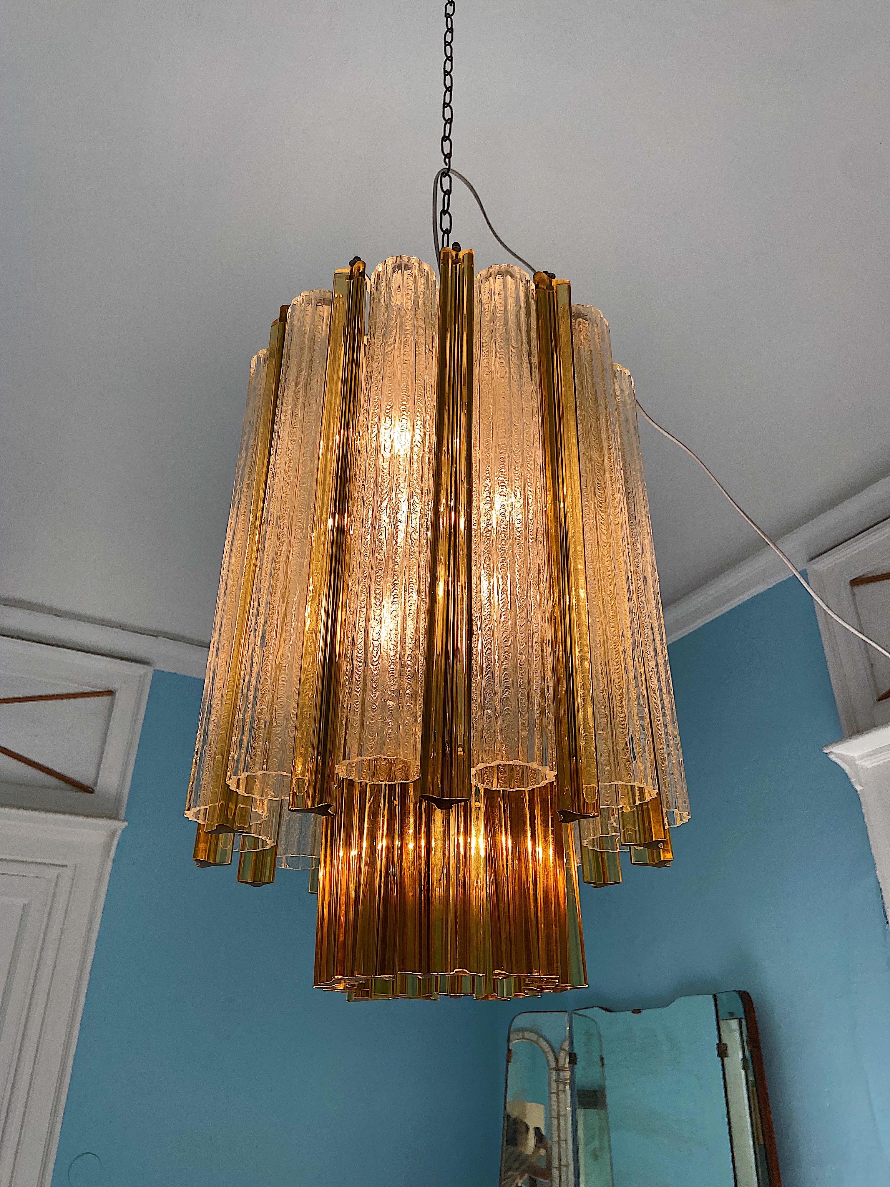 Mid-Century Modern chandelier by Venini. 42 Murano glasses set on a metal base consisting of 2 tiers.
The light has 7 bulbs. 

Details
Creator: Venini, Murano
Dimensions: Height without chain 60 cm Diameter: 40 cm. 
Materials and Techniques: