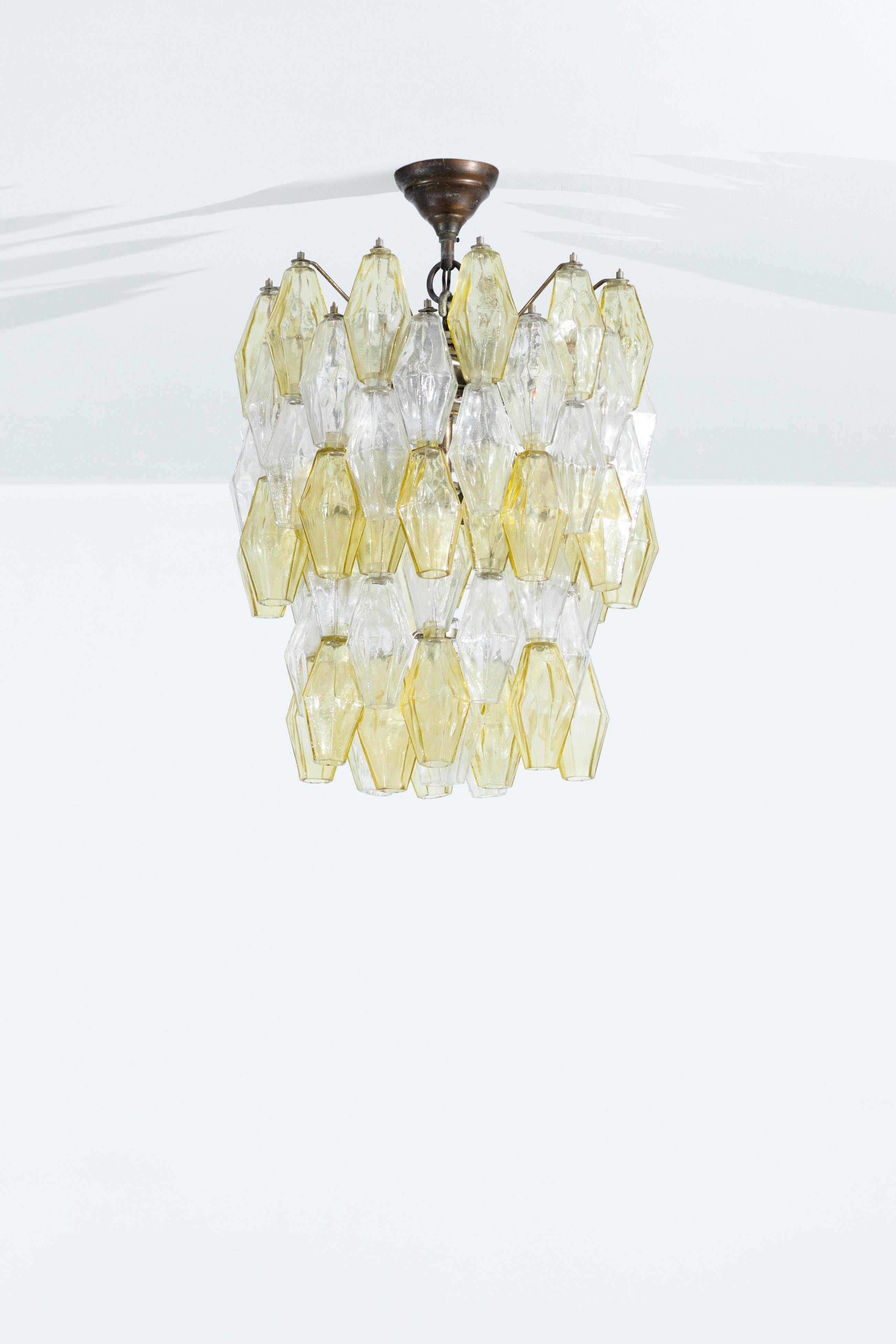 A stunning Murano white and yellow glass chandelier designed and edited by Paolo Venini in the 60s. Model Poliedri. Excellent vintage condition.Professional packing and shipping is provided.