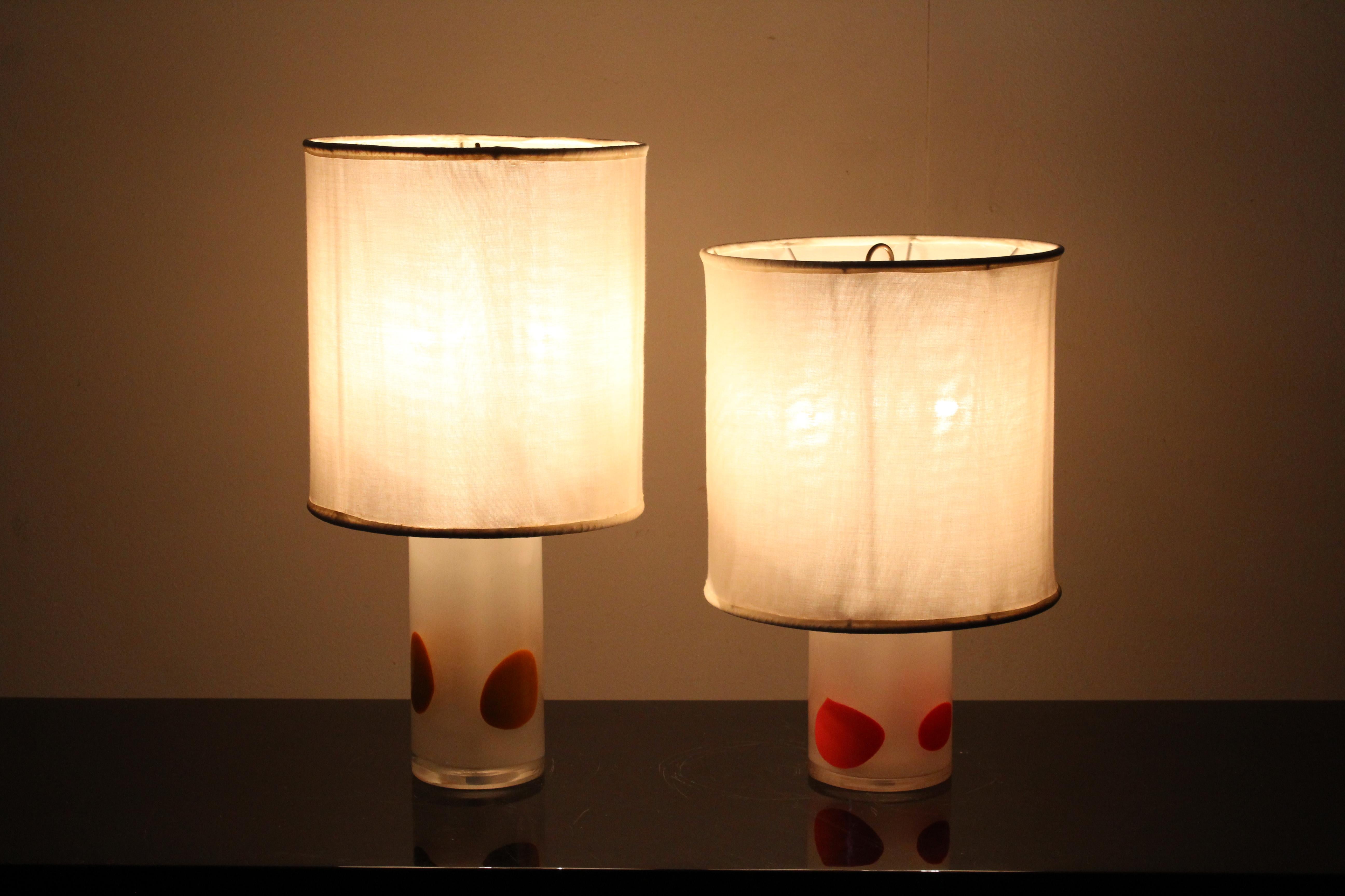 Pair of geometric table lamps with orange, yellow and withe, bodies, 1960s.
Wear consistent with age and use.
