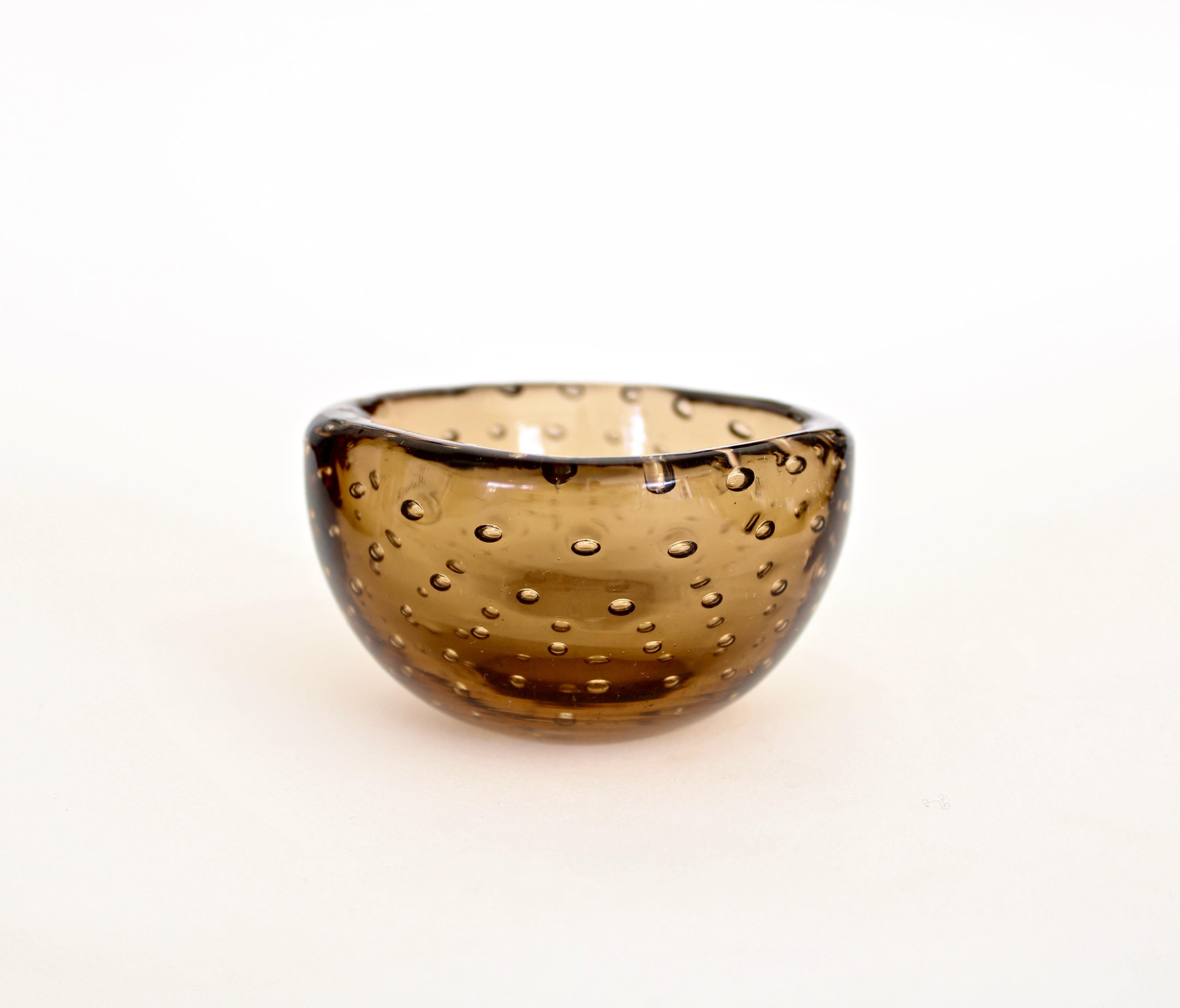 Small delicate amber brown Bullicante bowl designed by Carlo Scapra for Venini. 
The Venini glass works was started in 1921 by Paolo Venini, Giacomo Cappellin, and Andrea Rioda. The company was named Vetri Soffiati Muranesi Venini Cappellin & C in
