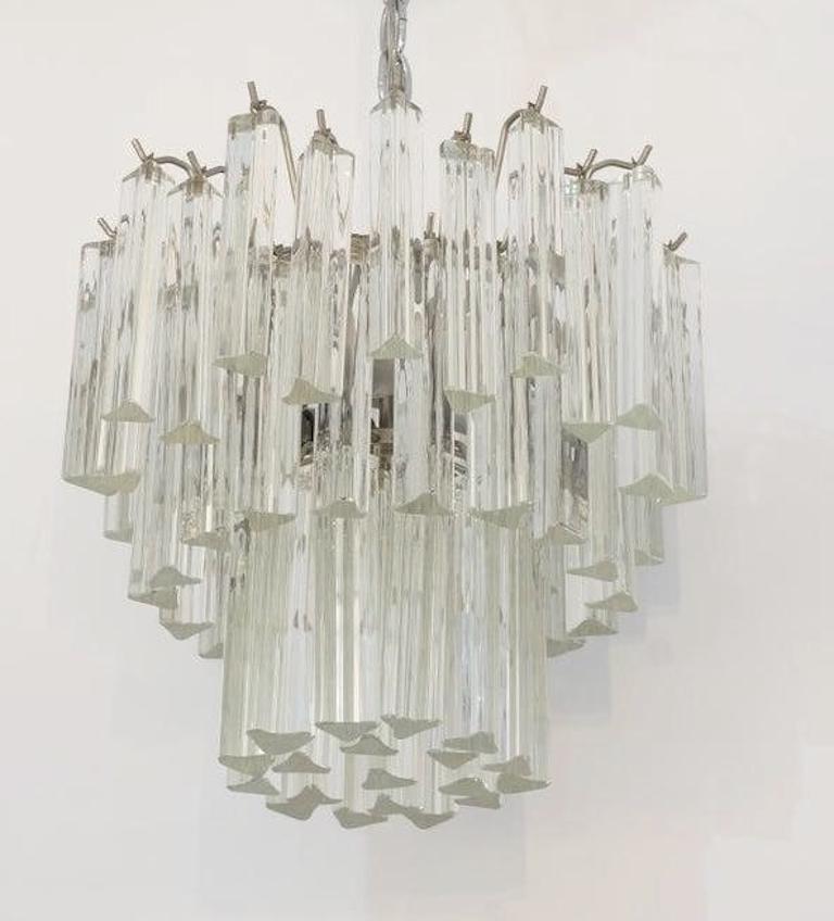 Mid-Century Modern Venini chandelier Murano glass from a Palm Beach estate

Measurement of the chandelier portion itself is 13 5/8 height x 13 1/2 diameter

Including the chain and canopy, total height is 23 5/8

requires 4 chandelier bulbs.