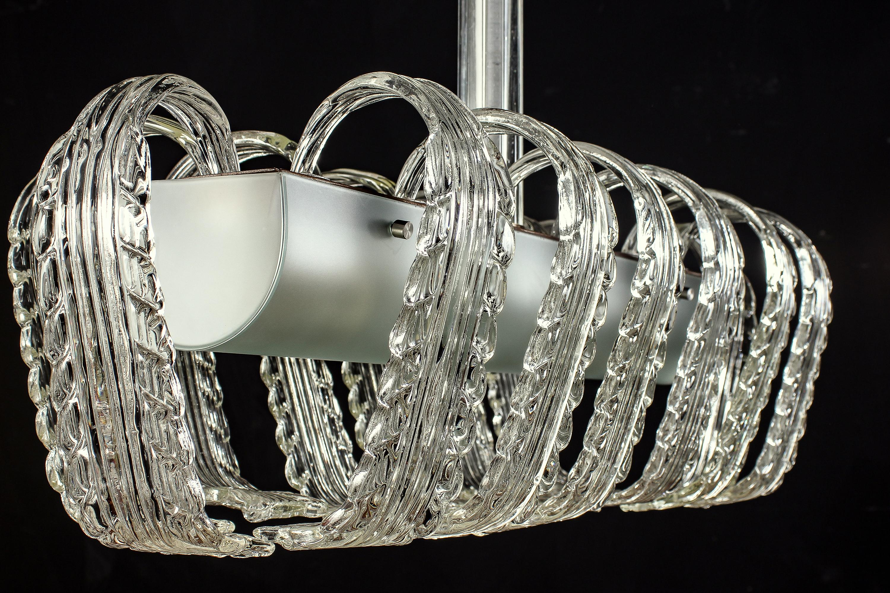 Fabulous Art Deco Murano glass rectangular shape chandelier with central light green glass support enriched with precious hand blown glass leaves.
Similar examples catalogue blue 134.