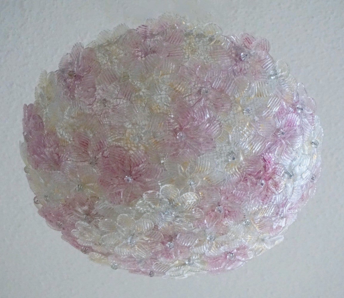 A lovely Murano glass flowers  three-ligh flush mount by  by Barovier e Toso, Italy, 1960s. Metal webbed white painted ceiling basket with overlapping hand-blown Murano glass flowers pink and ice with gold inclusion, individually attached. This