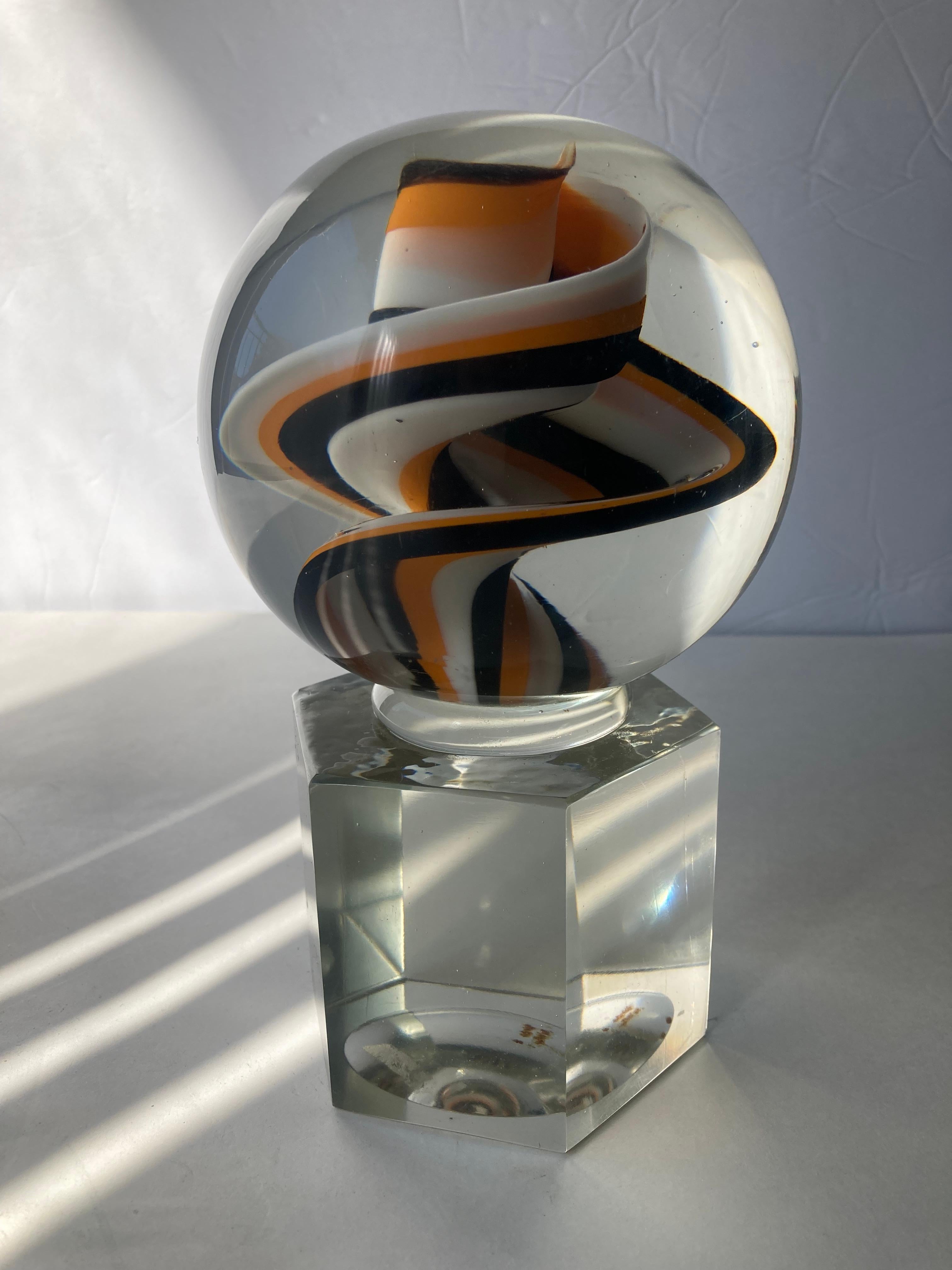 Beautiful Venini paperweight / abstract sculpture with a traditional swirl ribbon design. This is signed and is shown with circle marker in last picture, very faded, but is (Venini Italia) in the bottom. Shows a light ding in one of facet hexagon