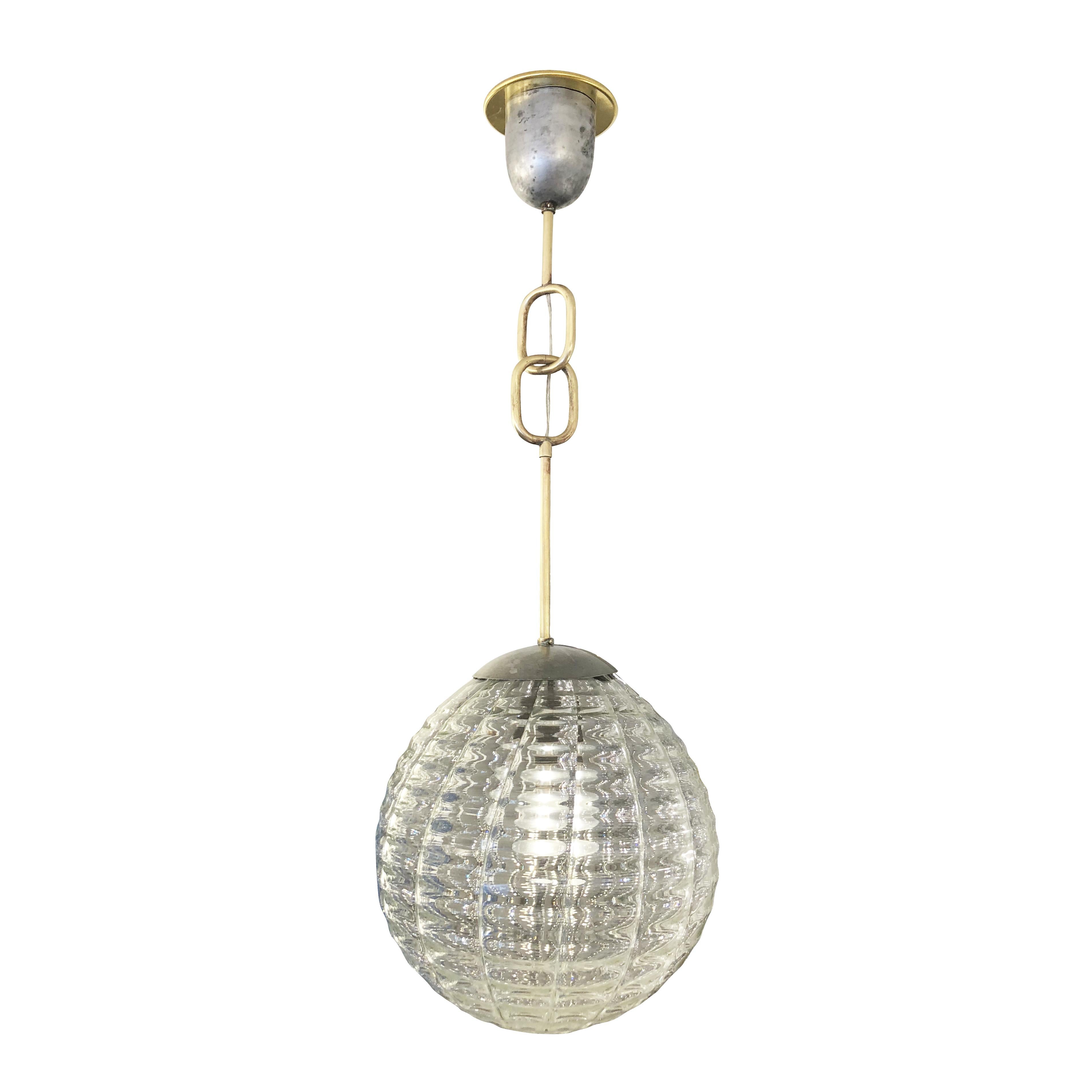 Stunning Murano glass pendant made by Venini in the 1940s. Particularly attractive is the large brass chain which gives the piece an imposing presence. Canopy and glass CAP are nickel for a balanced mixed metal look. Holds one regular