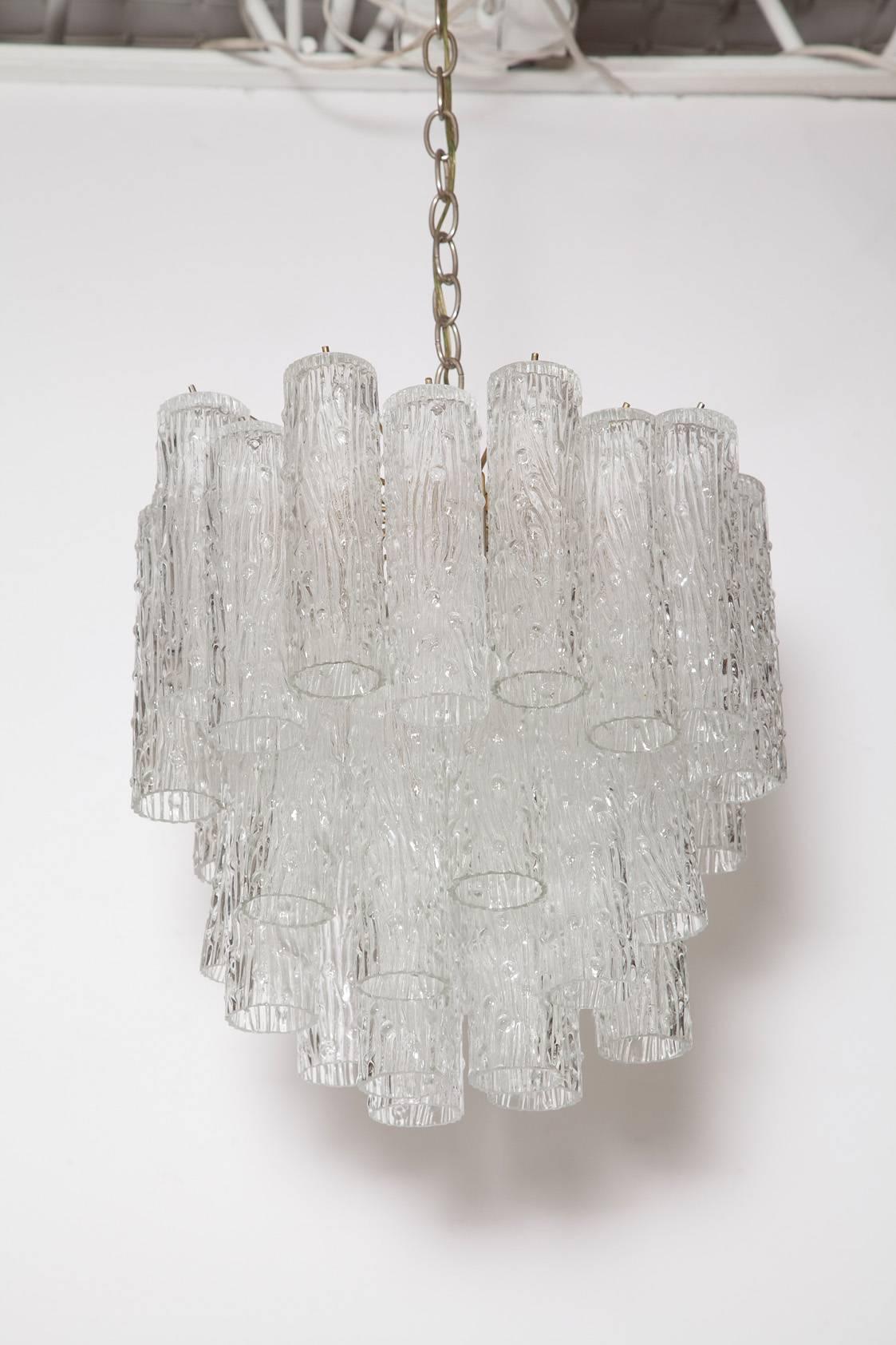 Nicely sized handblown Murano glass tubular tronchi chandelier with chrome frame by Venini, circa 1969.