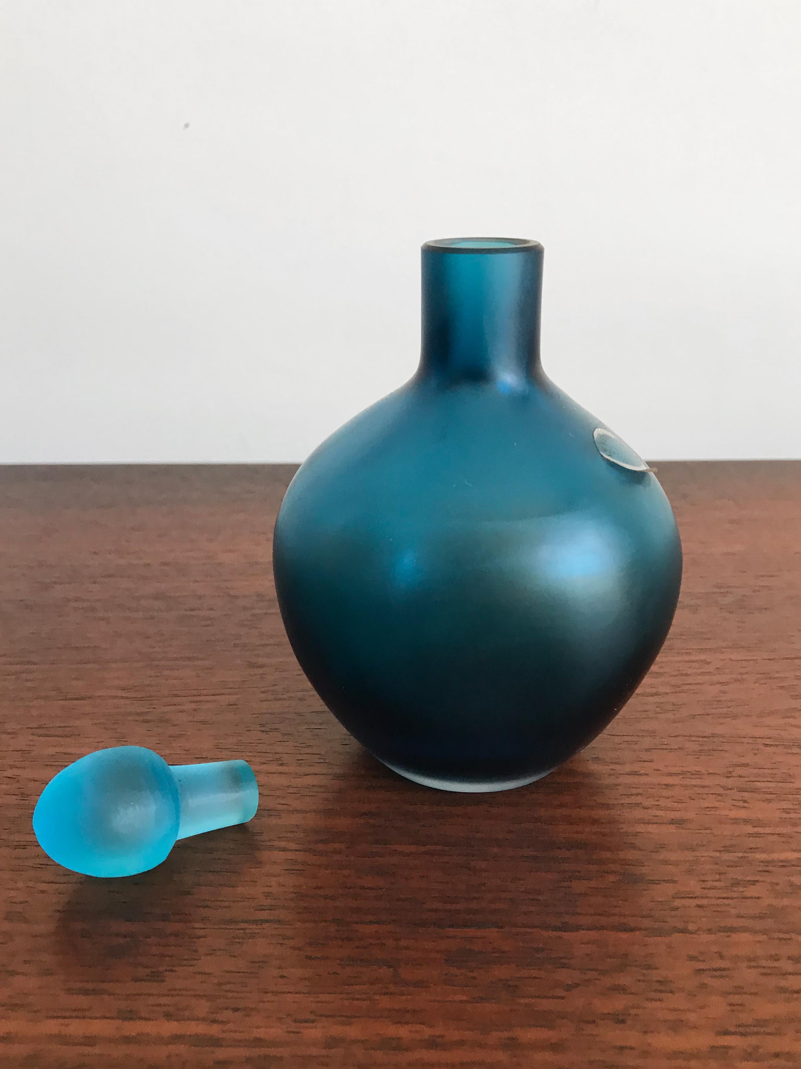 Amazing and fabulous very rare Italian handmade and blown bottle in light blue color glass with stopper, from the “Velati” series designed and produced by Venini Murano in 1995.

Logo Venini 1995 engraved by the producer on the bottom.
  