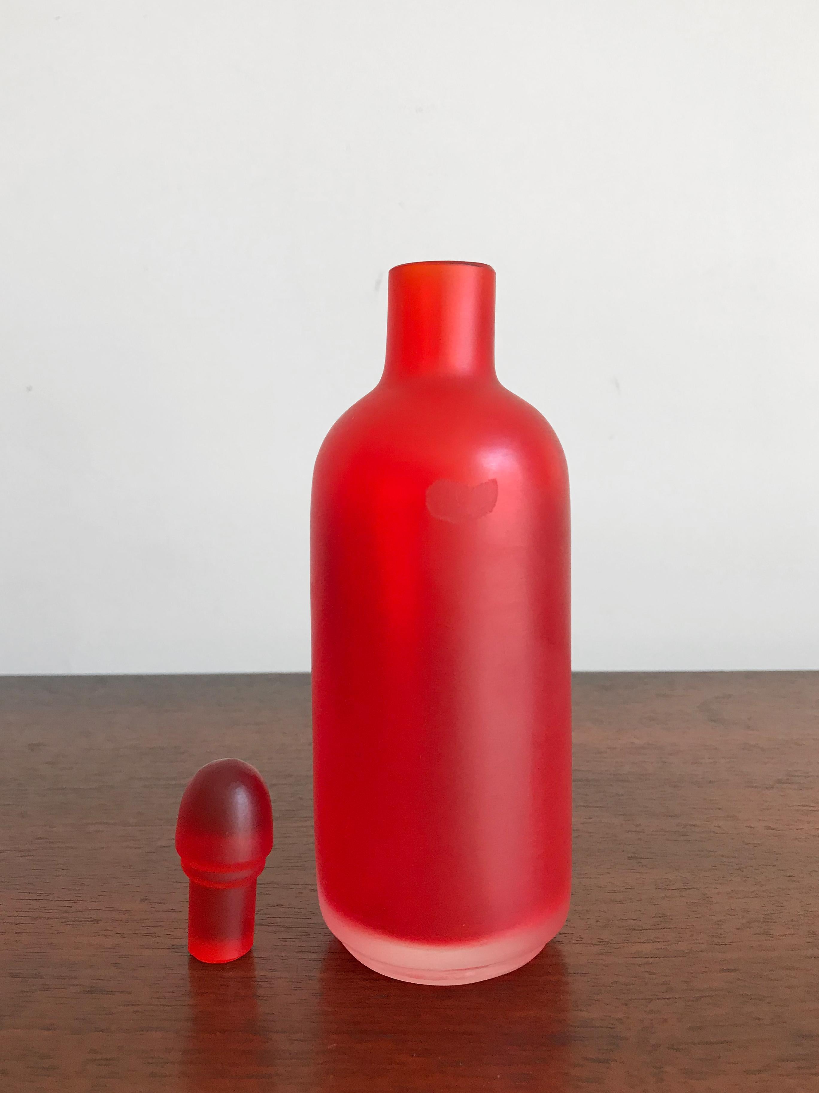 Amazing and fabulous very rare Italian handmade and blown bottle in red color glass with stopper, from the “Velati” series designed and produced by Venini Murano in 1995.

Logo Venini 1995 engraved by the producer on the bottom.
  