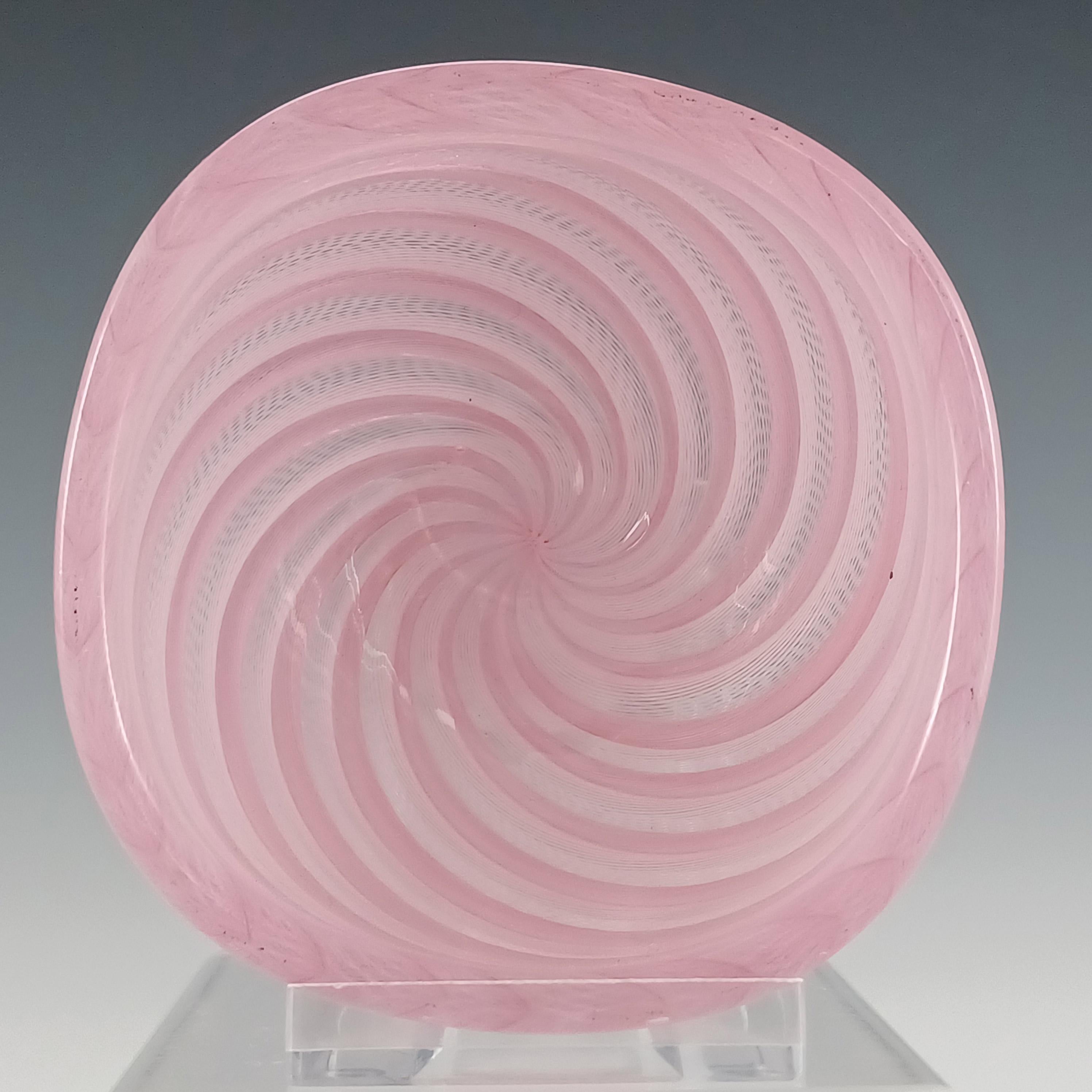 Here is an exquisite 1950's Venetian pink and white glass bowl, made with alternating stripes of lattice criss cross zanfirico filigree strands. Made on the island of Murano, near Venice, Italy, by famous manufacturers Venini. Bears their three line