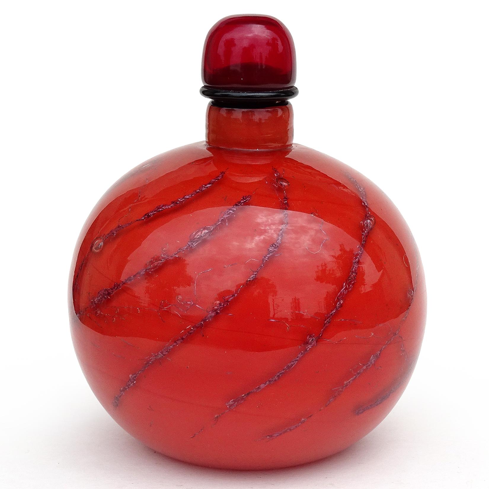 Beautiful, and very rare, vintage Murano hand blown coral red with copper filaments Italian art glass perfume / cologne bottle. Documented to designer Toni Zuccheri for Venini, circa 1964 from the 