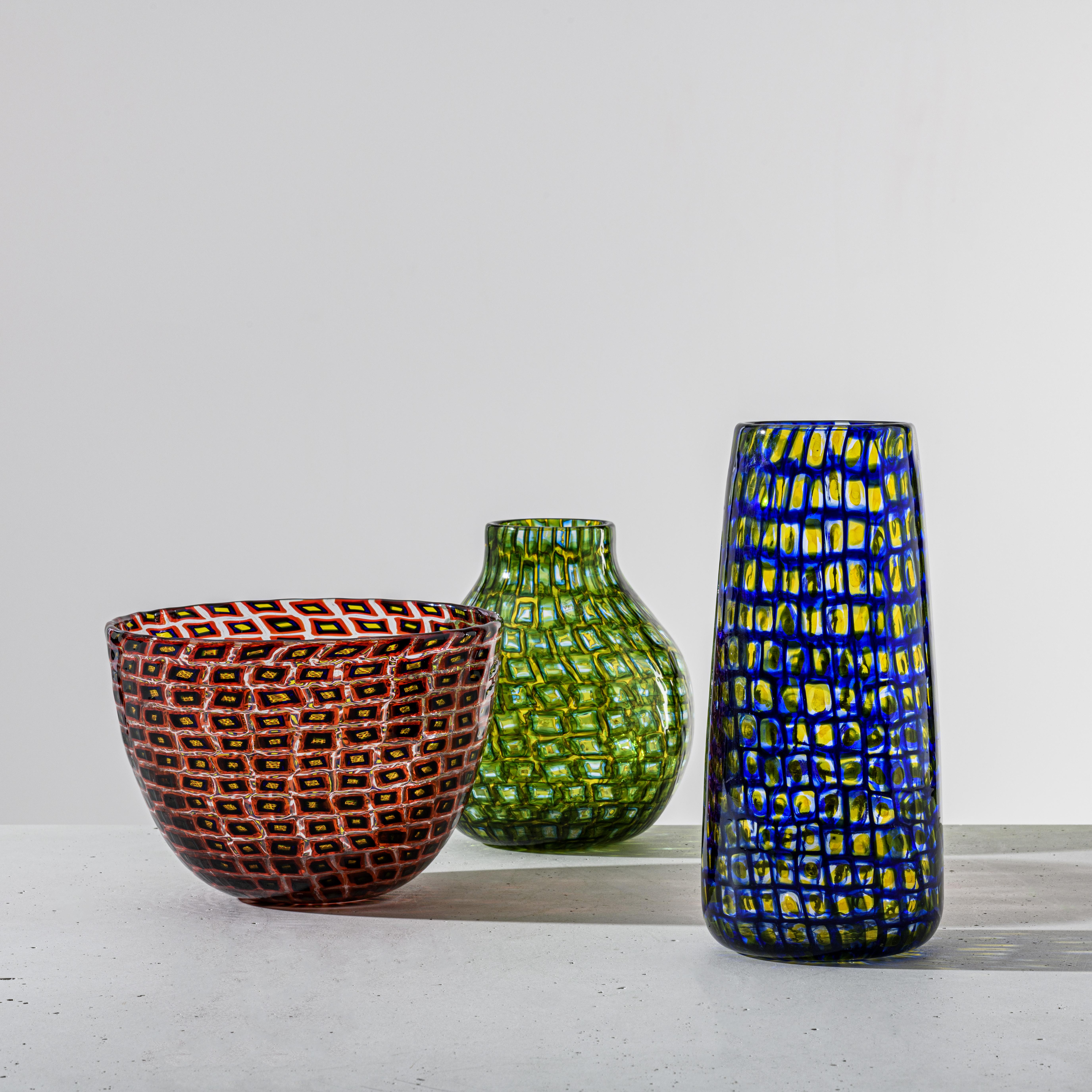 Venini Murrine Romane vase in multi-color by Carlo Scarpa. Numbered Edition. These Murrine are called “roman” due to their graphic signs and because they seem to create an optical illusion. They are a rare and precious object like it was popular