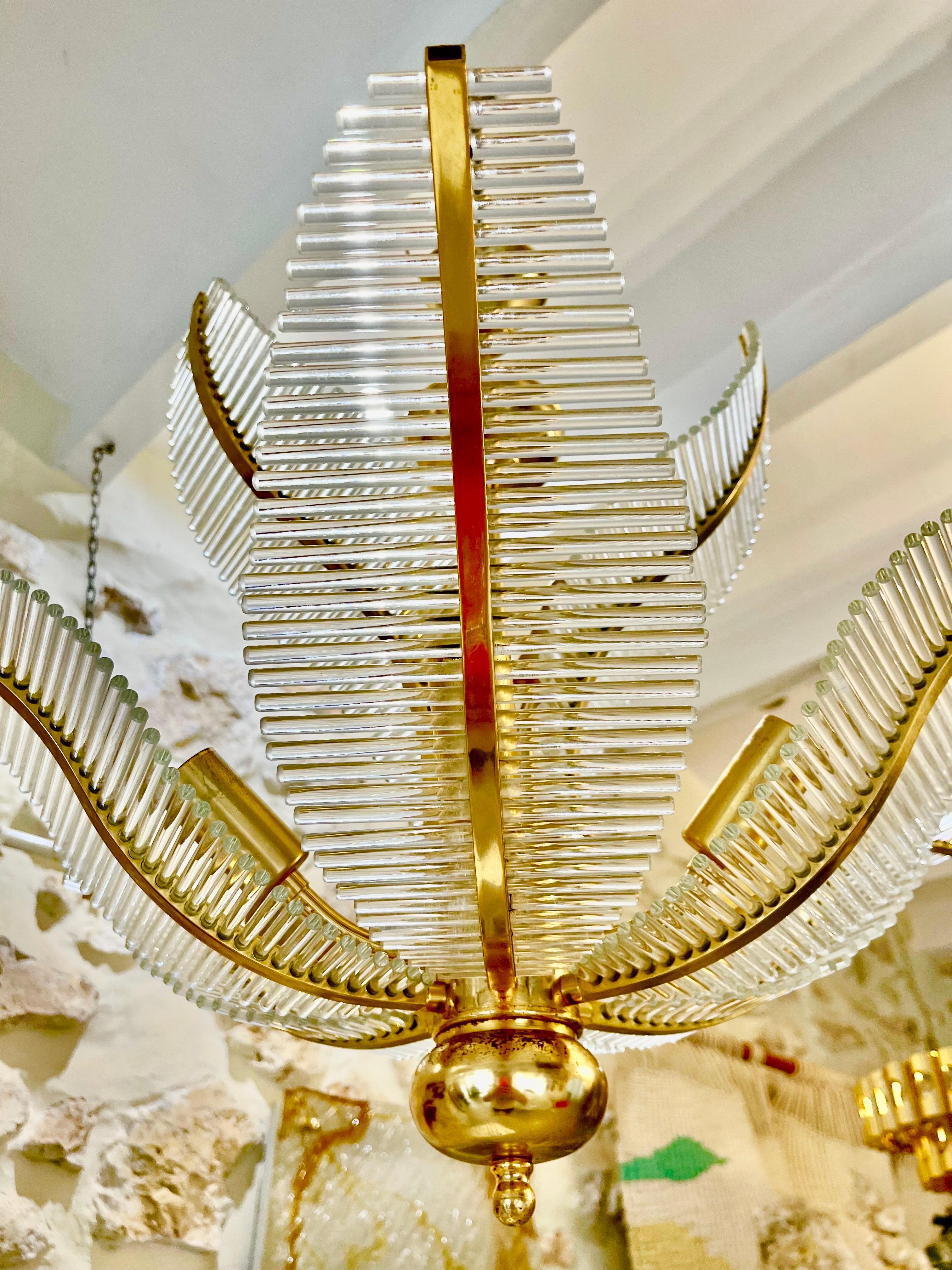 Exceptional Venini PALM chandelier with tube Murano glass with gilded gold structure. The design and the quality of the glass make this piece the best of Italian design.

This unique PALM chandelier by Venini in murano glass is exceptional.
discount