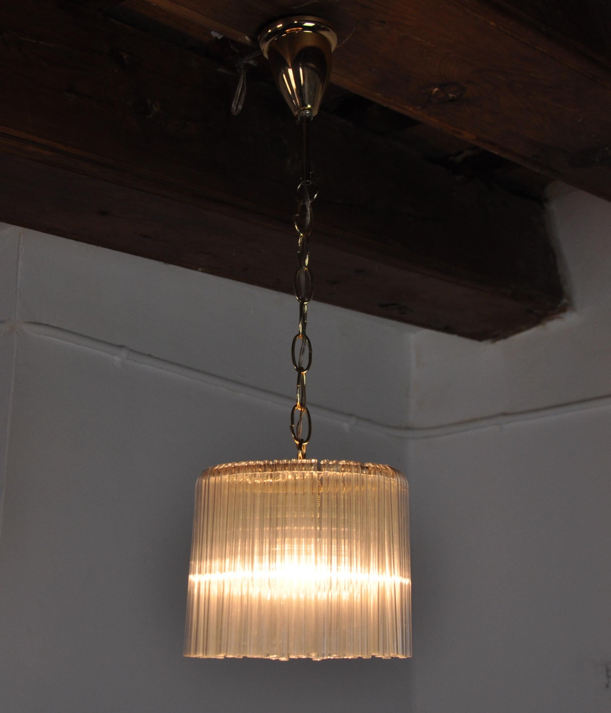 Very beautiful Venini pendant light produced in Italy in the 70s. Tubular glass and gold metal structure. Unique object that will illuminate wonderfully and bring a real designer touch to your interior. Electricity checked, time stamp consistent