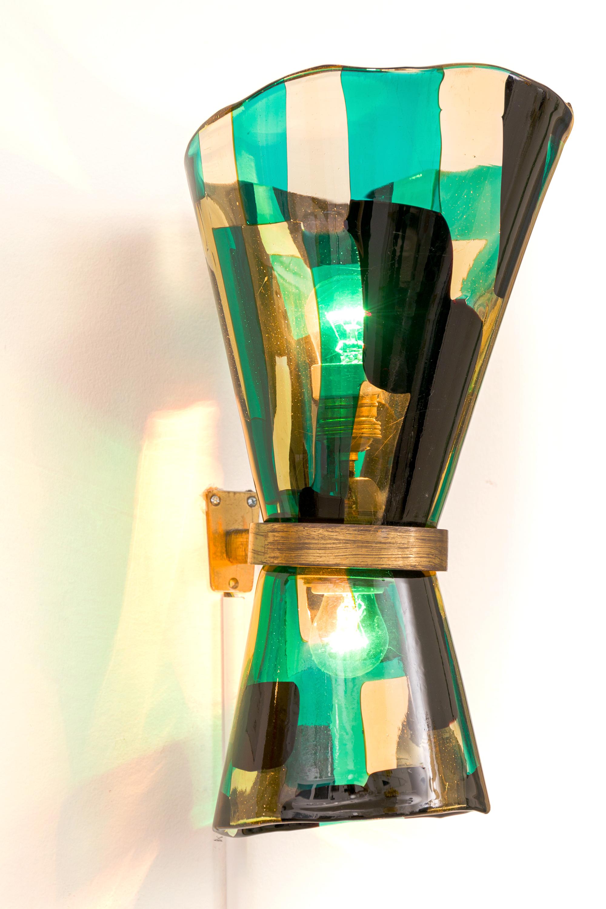 Pezzato glass was developed in the 1950s by Fulvio Bianconi for Venini & C. of Murano. The piece is covered with a patchwork of rectangles of different colors, heating the slices until the glass is soft and then picking them up and smoothing them to