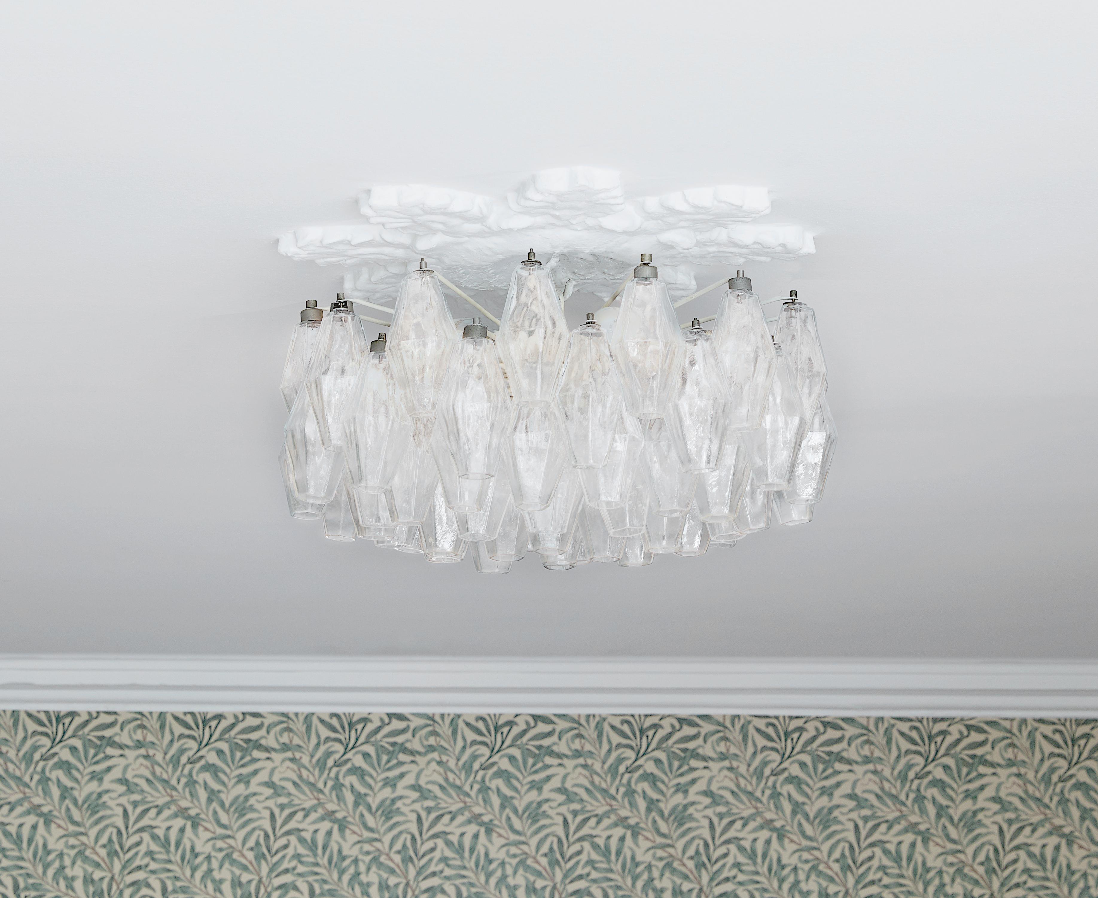 Lovely polyhedral chandelier in clear blown glass. Manufactured in Italy during the 1960s.

         