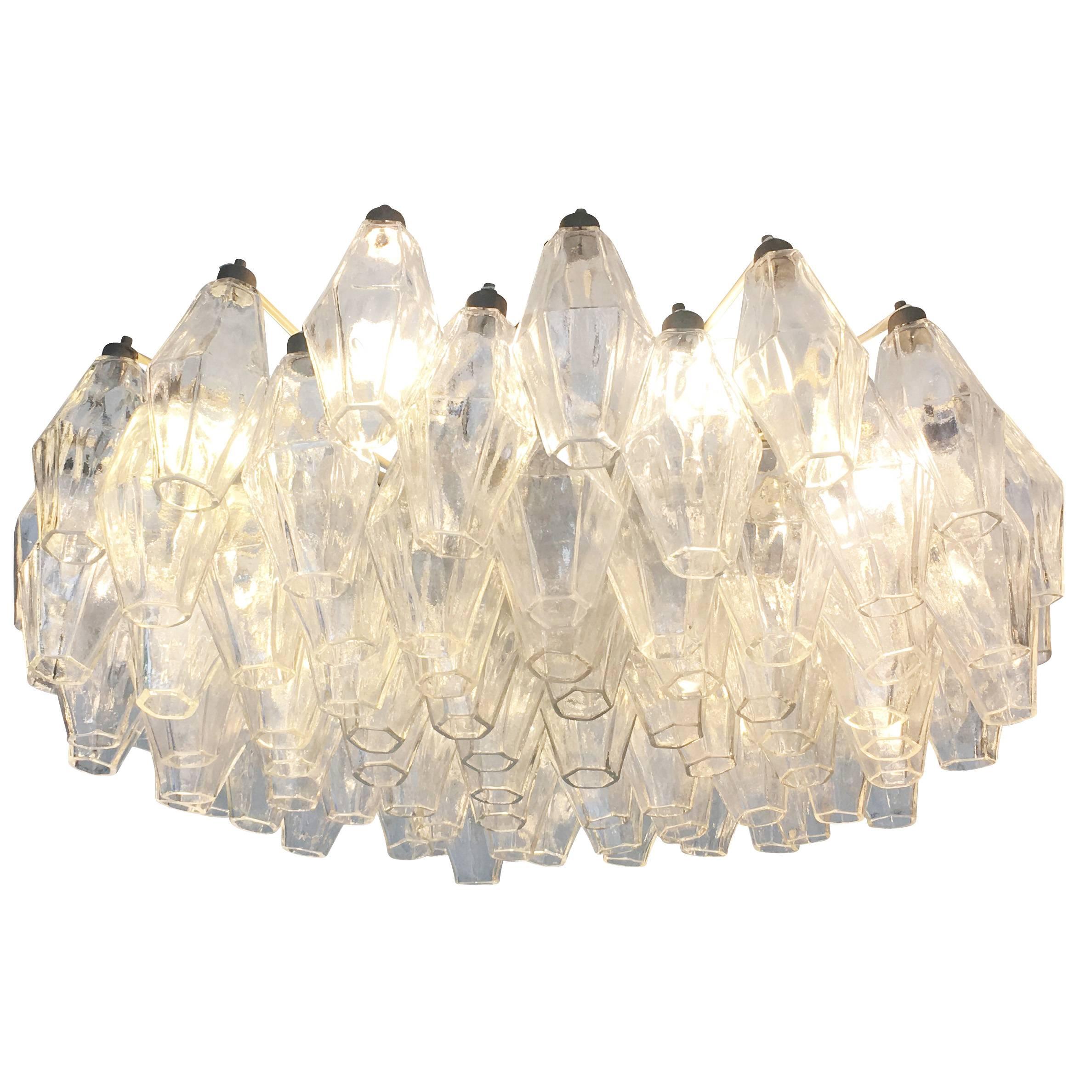 Original polyhedral chandelier made by Venini in the 1960s. This timeless Murano fixture has clear hand blown glasses on an off-white frame. Some tinted glasses are available if one wished to add a pop of color. Can be semi-flush mounted or hung on