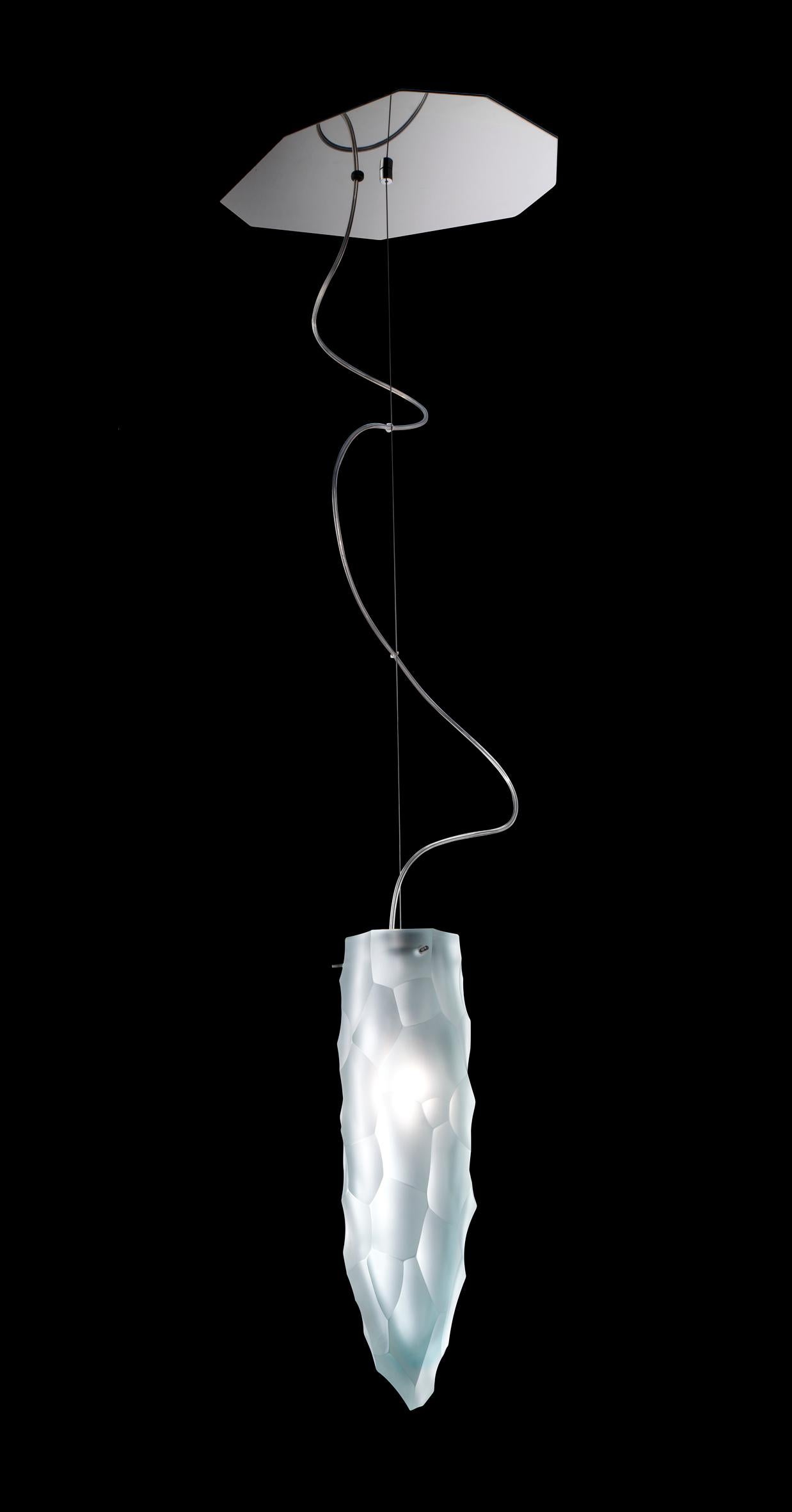 Siderale suspension lamp, designed by Giorgio Vigna and manufactured by Venini, features handmade blown and grinded glass cones. 