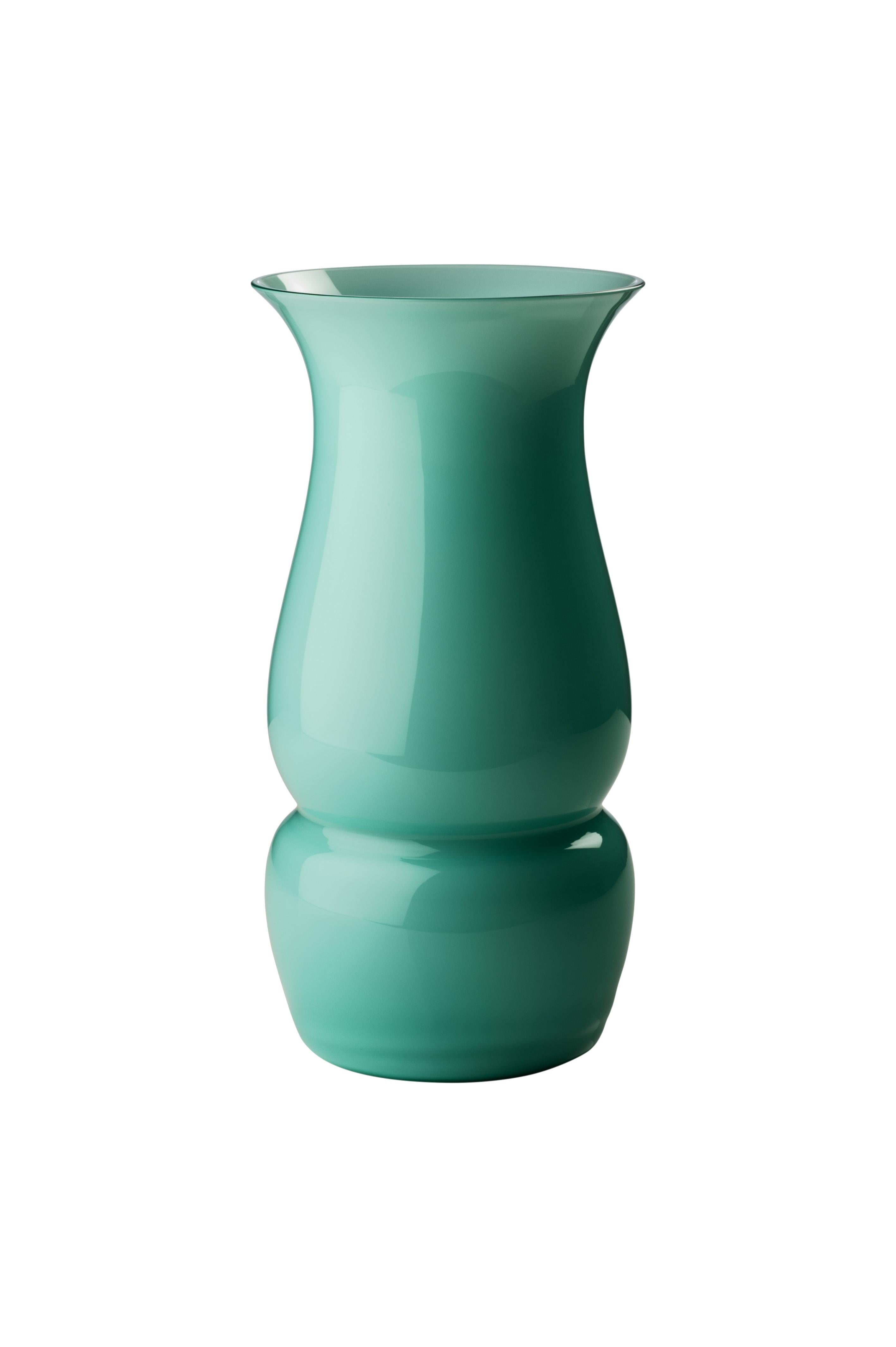 Venini glass vase with elongated body and funnel shaped neck in mint green designed by Leonardo Lanucci in 2016. Perfect for indoor home decor as container or strong statement piece for any room. Also available in other colors on